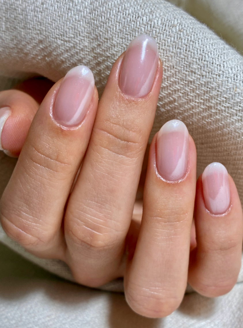 Soft Baby Boomer Ombré Natural, soft pink base with subtle white tips, French manicure / baby boomer ombré effect on almond shaped nails.