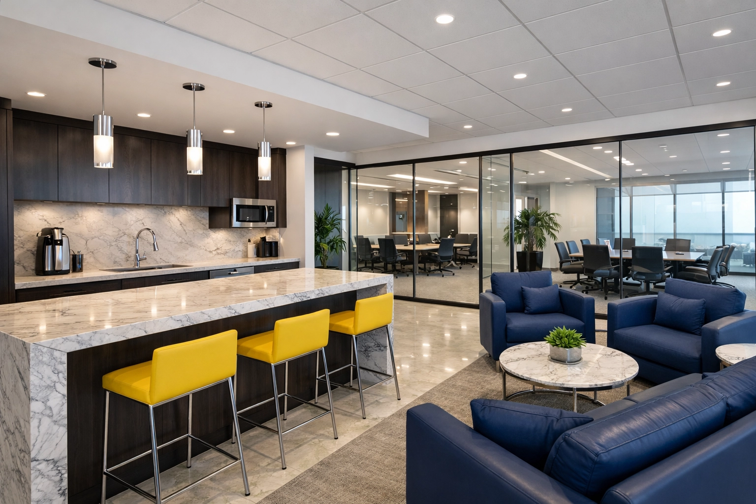 Sanitized contemporary office lounge and kitchenette with polished marble counters in a Somerville commercial space.