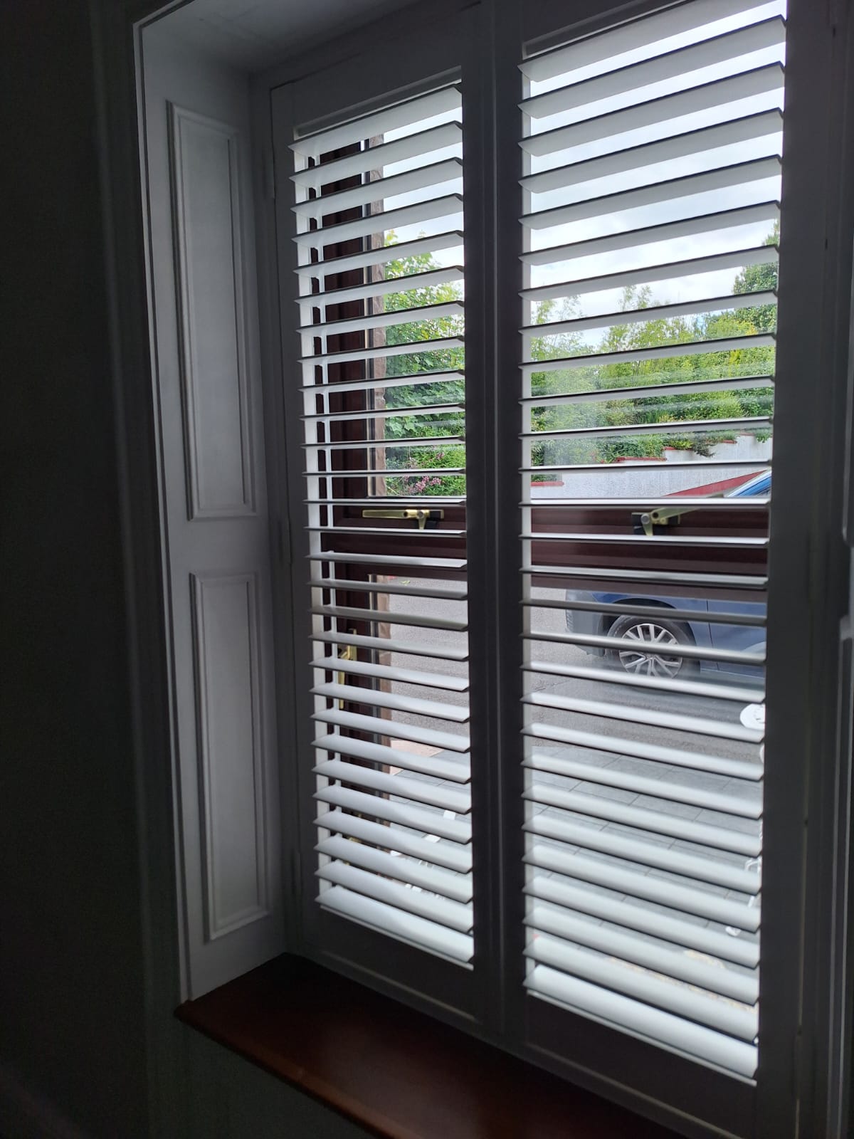 Premium bespoke white shutter blinds, custom-manufactured in-house by Fiesta Blinds, providing excellent light control and a modern finish.