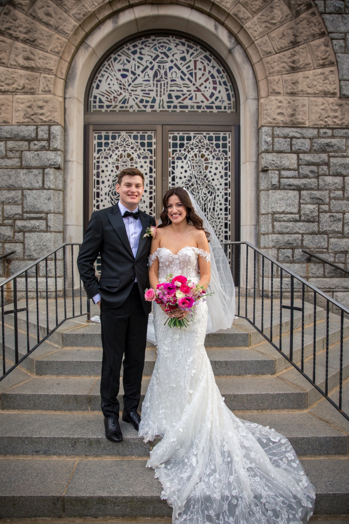Leighanna & Brian on the church steps—just married and soaking it in
