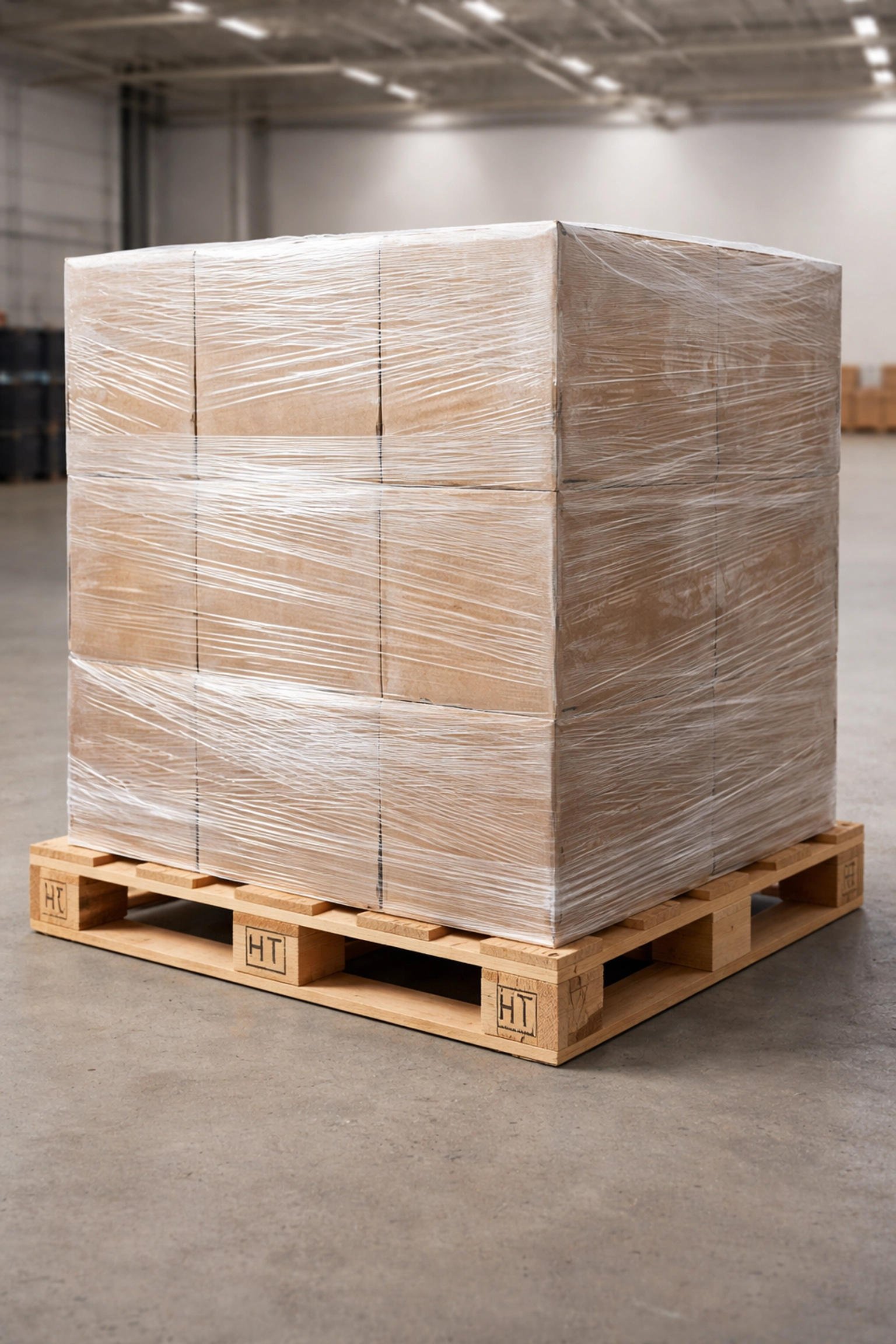 Heavy-duty ISPM15 wooden export pallet loaded with shrink-wrapped industrial goods, demonstrating robust export packaging solutions.