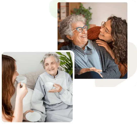 Two carers provide companionship and support to elderly women in a home setting. Both elderly women are smiling and engaged, highlighting positive relationships and independence.