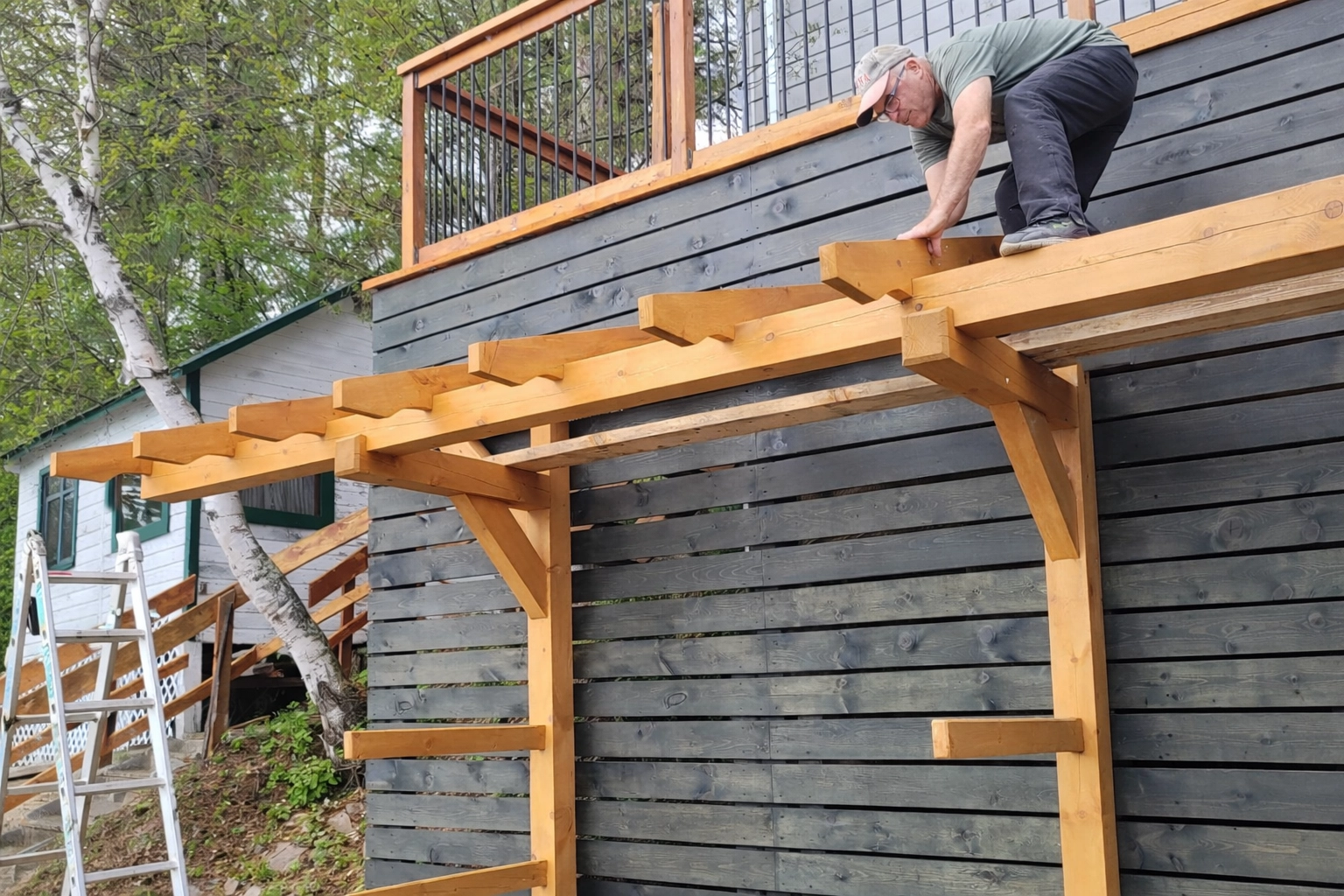 Installation in progress: pecan-stained timbers with ebony backer boards