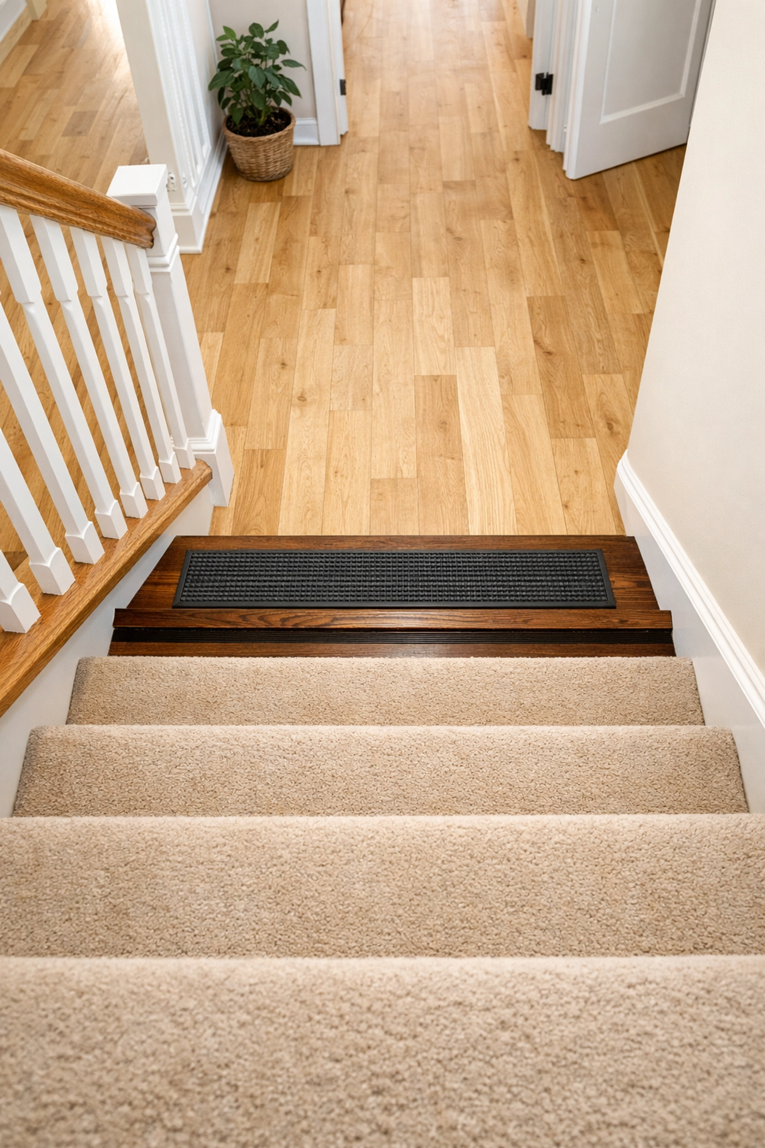High-contrast bottom step marking on a staircase to improve depth perception and prevent falls.
