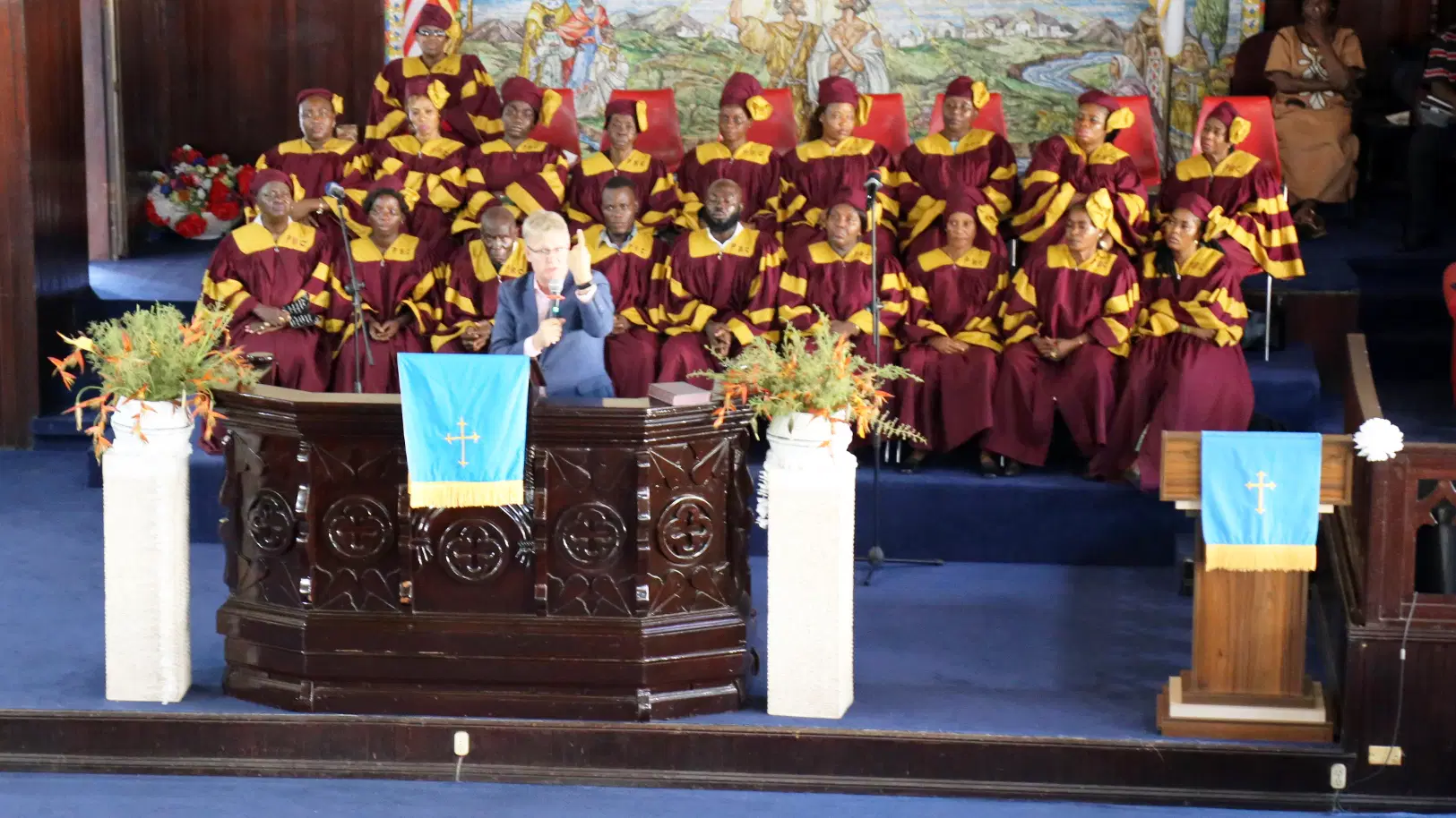 A diverse group engaging in outward worship through community service, representing whole-life worship as light.