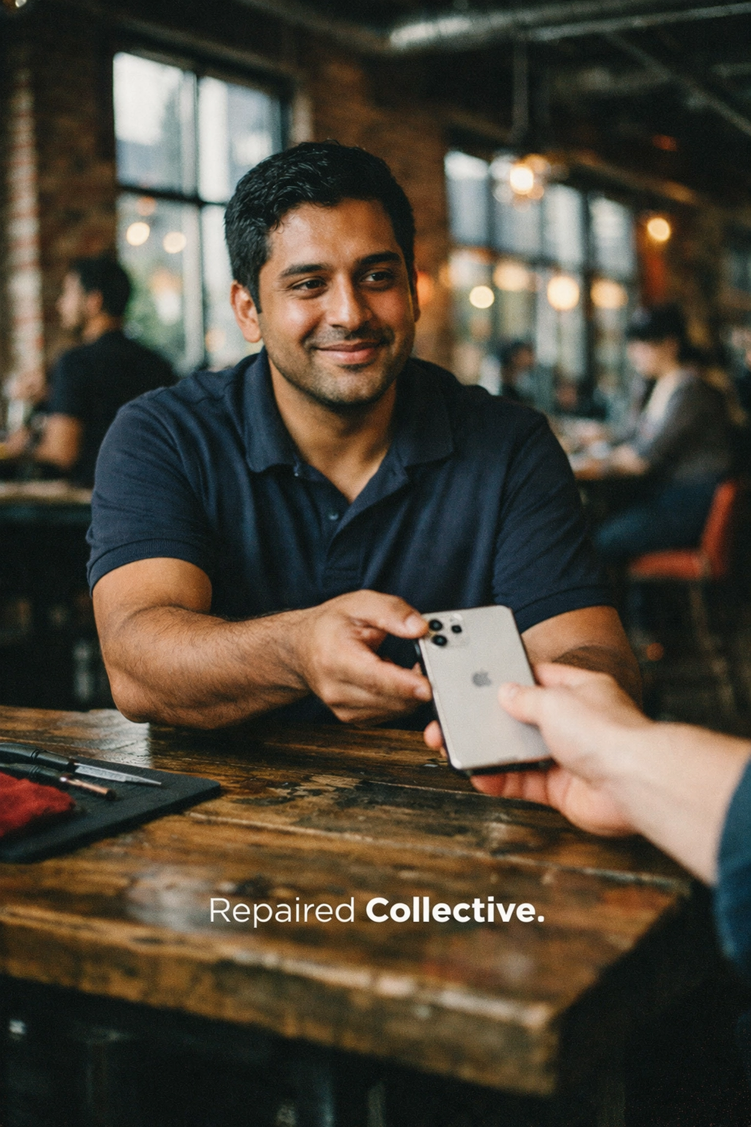 Repaired Collective technician providing mobile on-site iPhone repair at a local Downtown Brooklyn cafe.