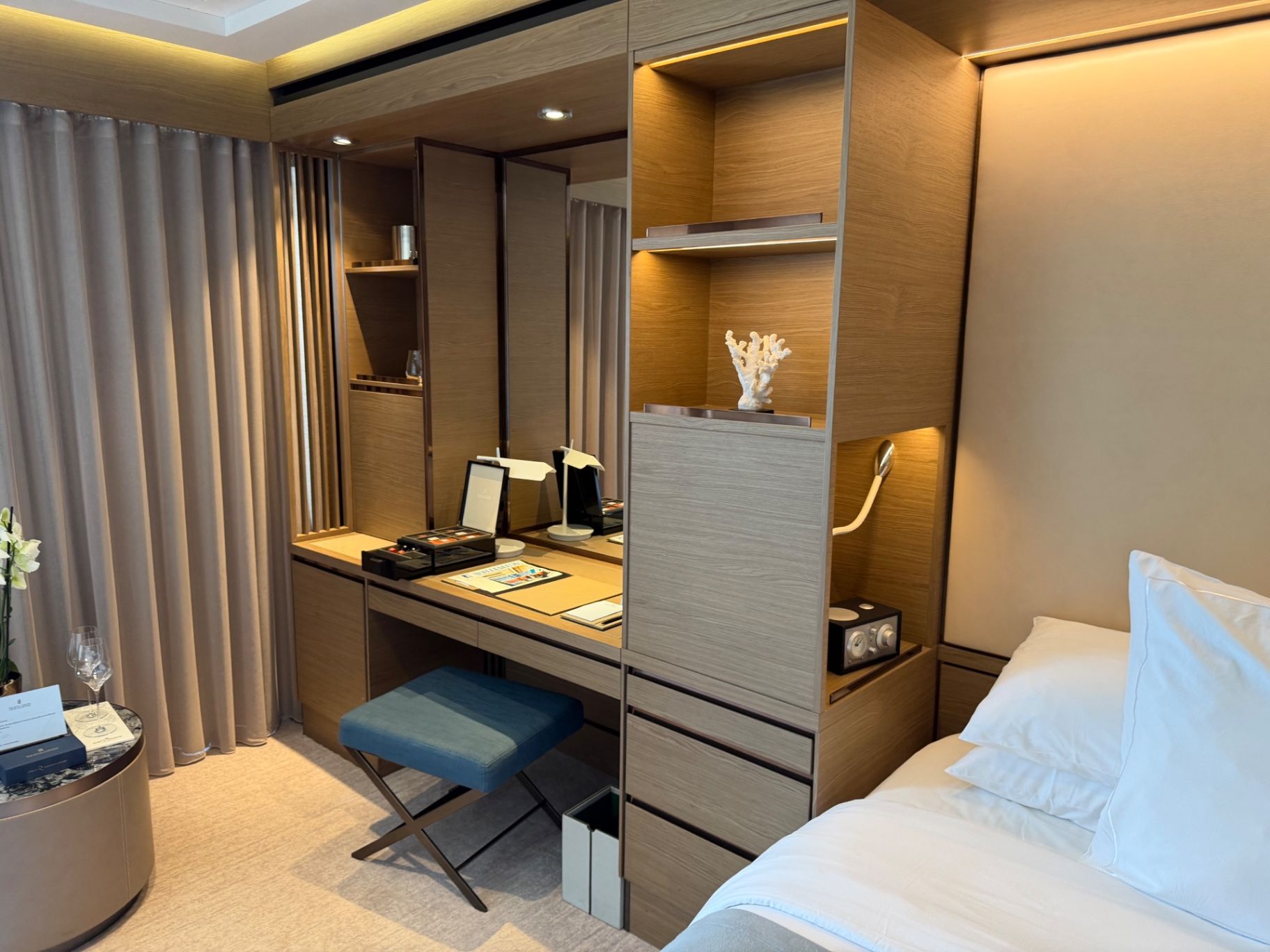 a bedroom with a bed and a desk