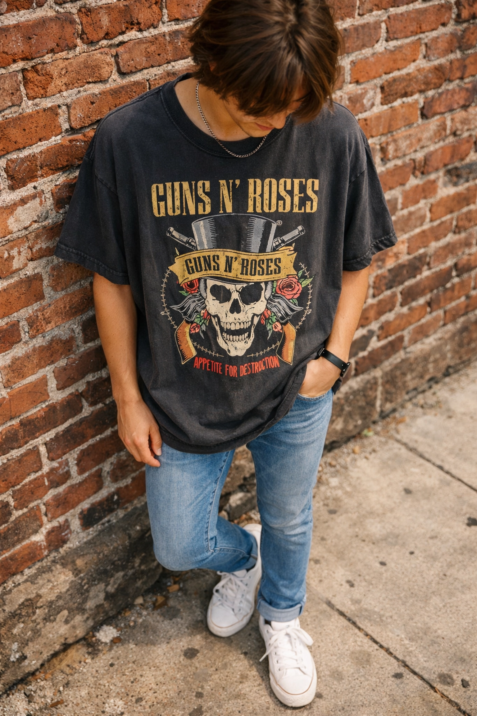 Oversized band tee styled with slim-fit jeans for balanced streetwear look