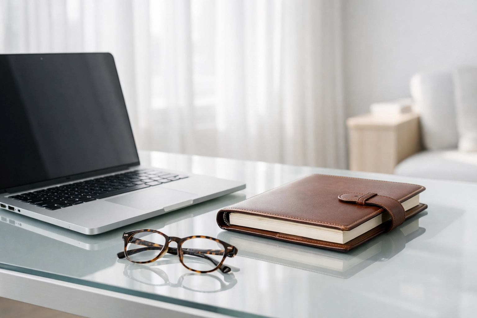Modern tax professional desk with laptop and planner for managing ERO operations and IRS compliance.