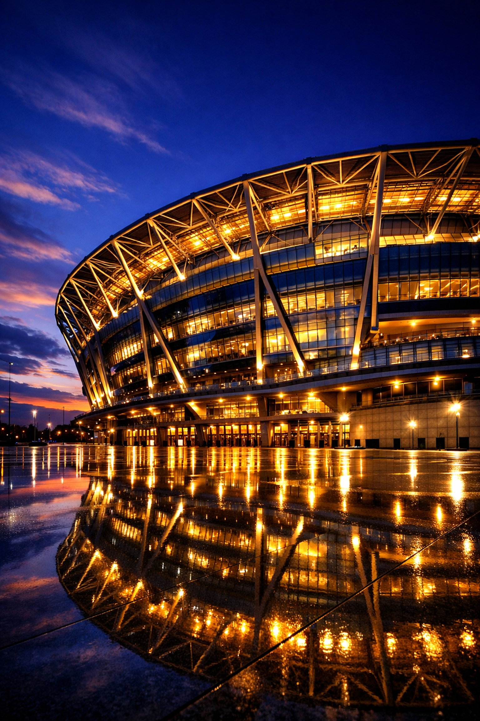 Stunning modern stadium architecture at dusk representing excellence in sports media.