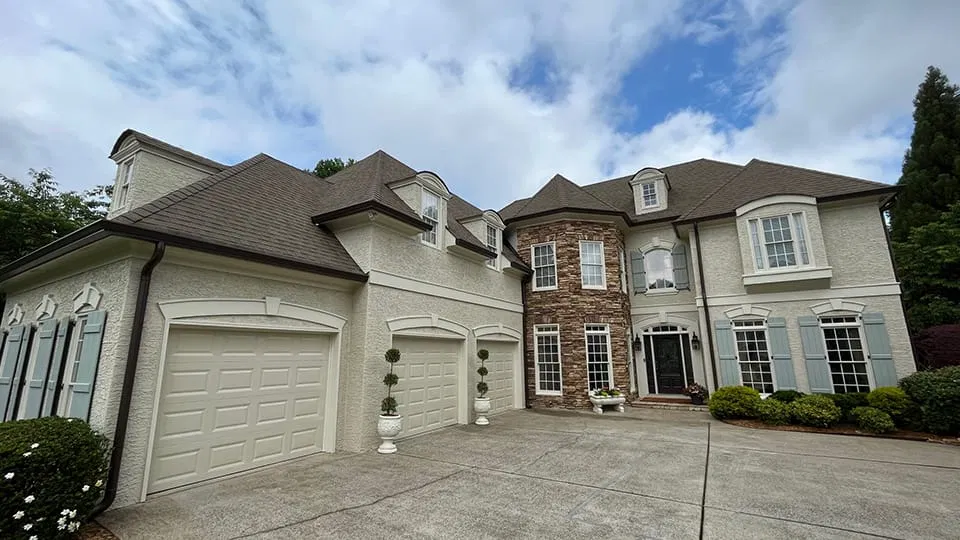 Large two-story home with a professionally installed roof and fresh paint