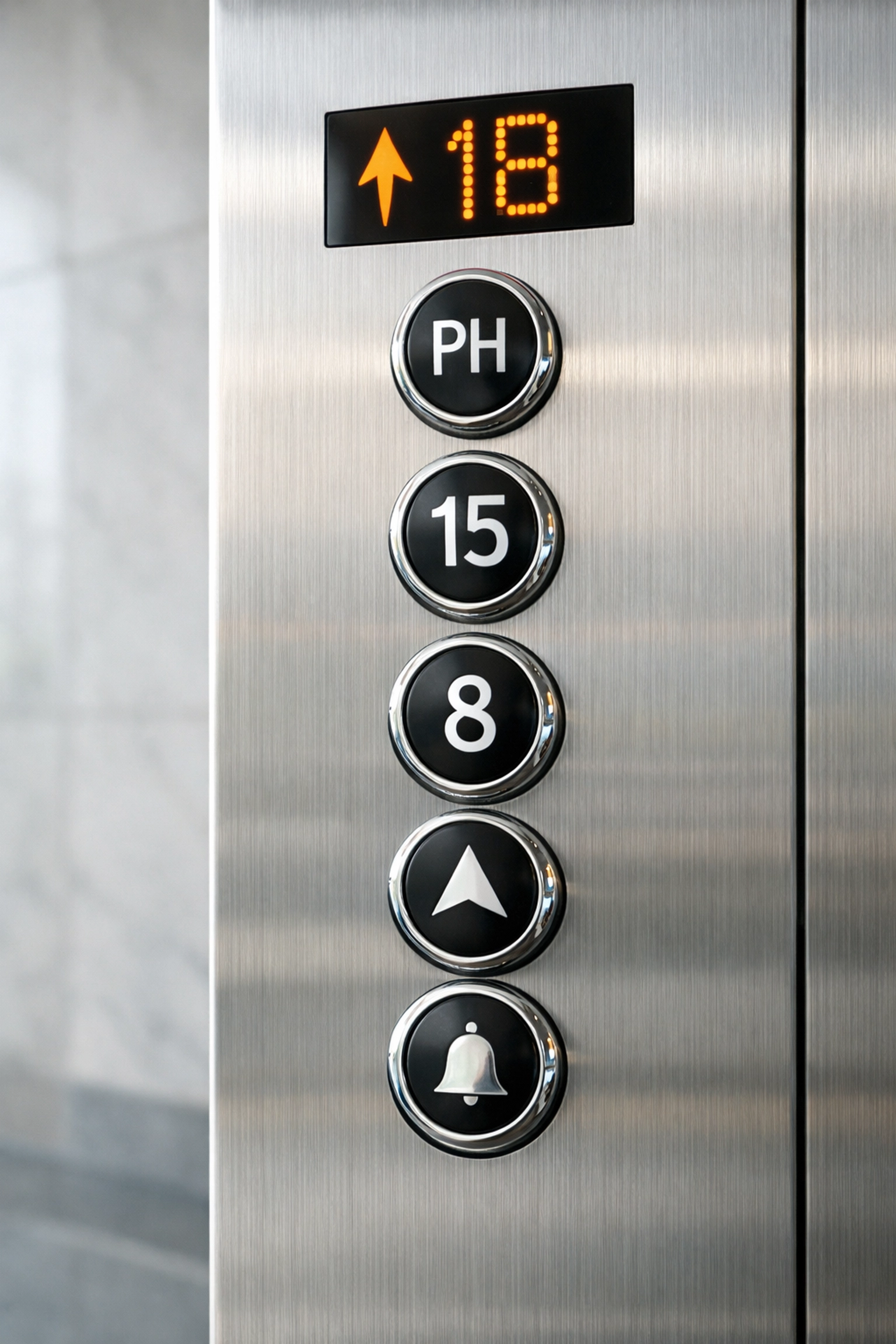 Clean elevator buttons in a modern office lobby showcasing professional disinfection of high-touch surfaces.