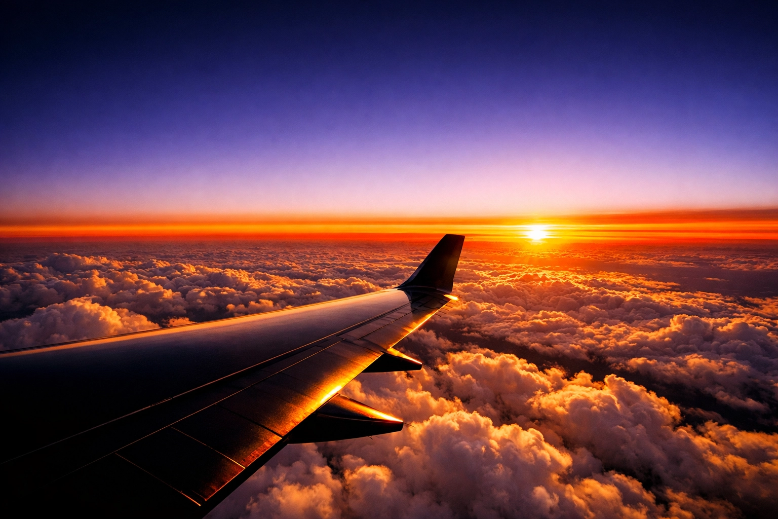 Aerial view from a jet wing symbolizing the visionary 30,000-foot strategy of a scaling business.