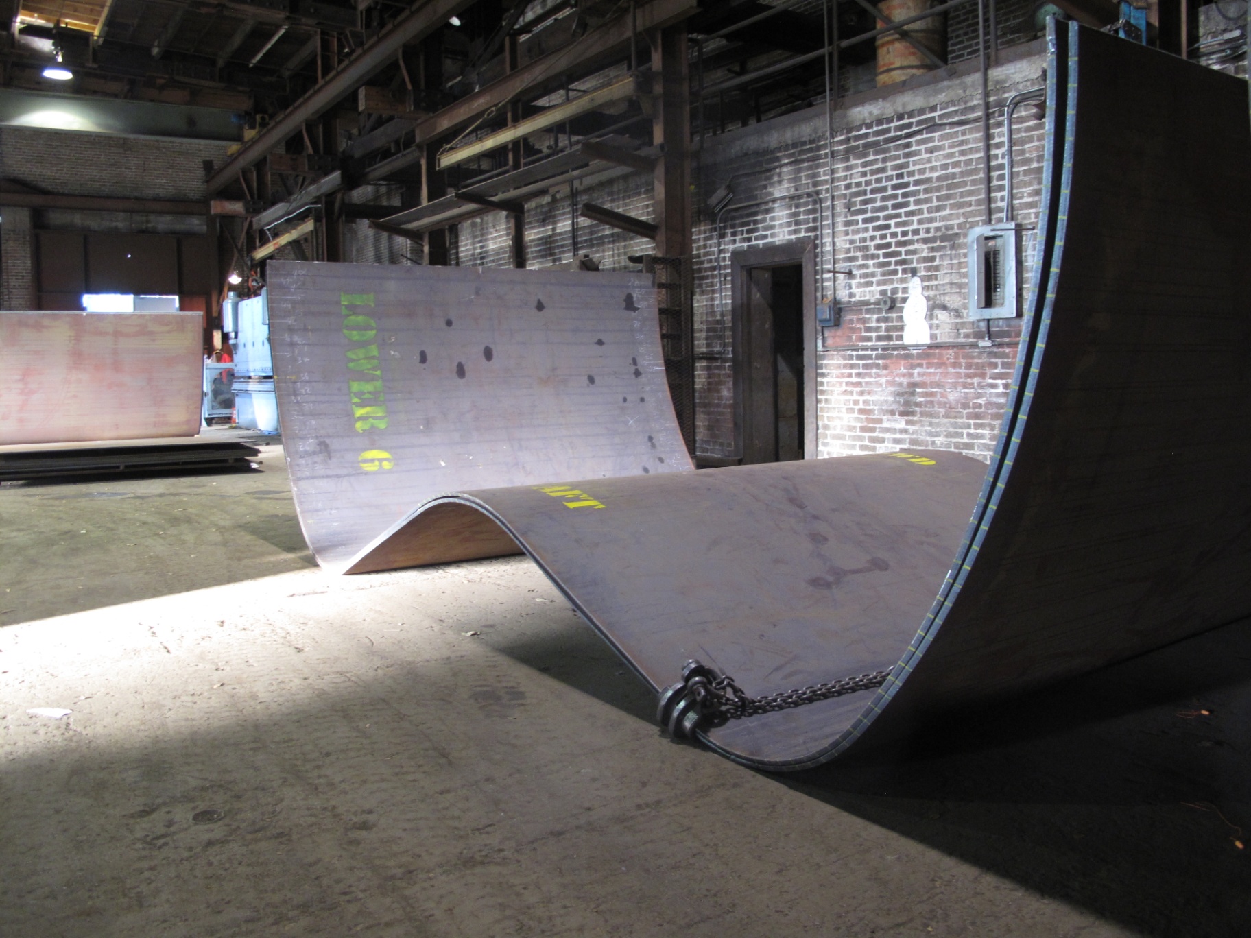 Image of curved steel plates for shipbuilding