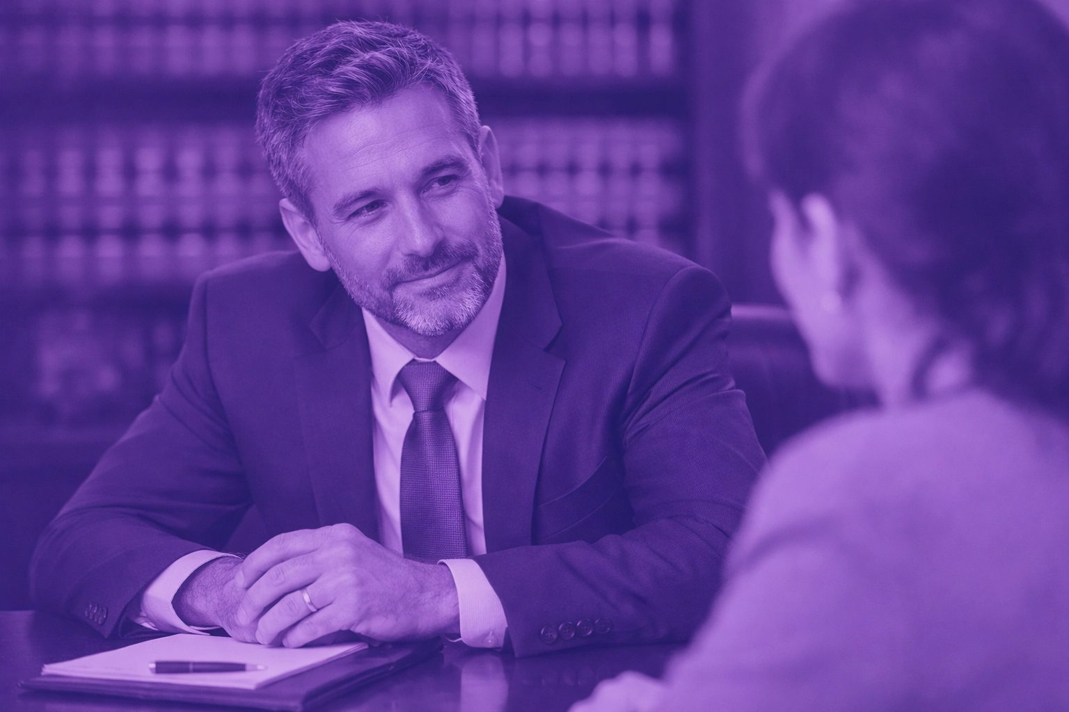 Professional attorney conducting a consultation, showing the human touch in legal services.
