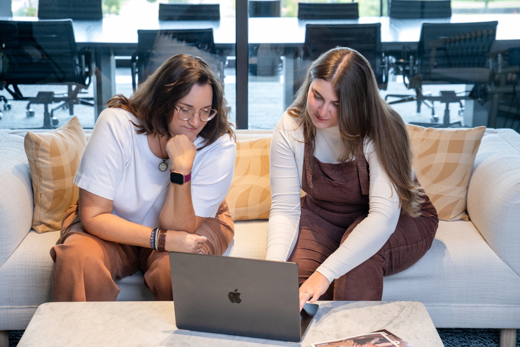 Two women collaborating in a modern office
