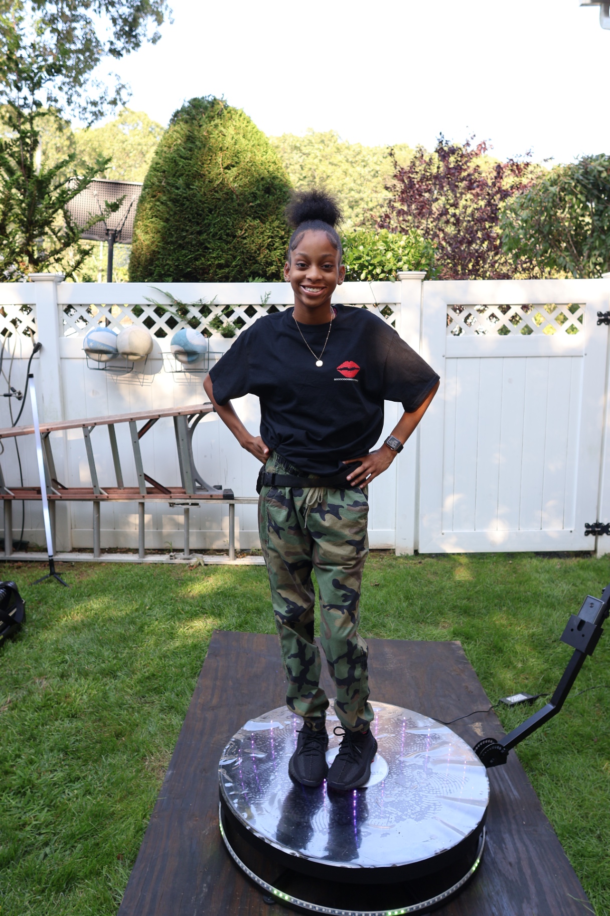 Young Woman on 360 Photo Booth Outdoors