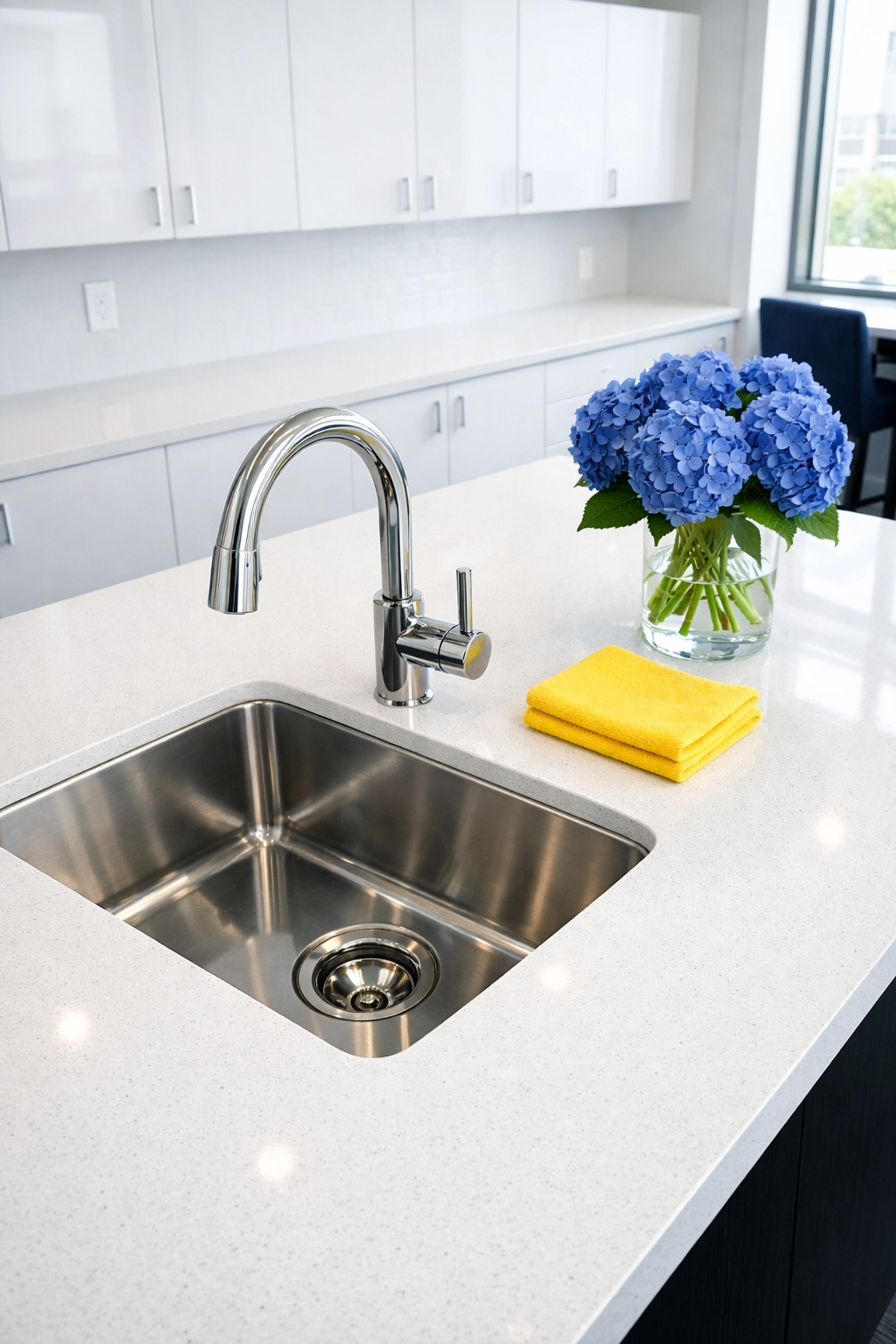 Spotless Burlington office breakroom featuring a deep cleaned white countertop and shining stainless steel sink.