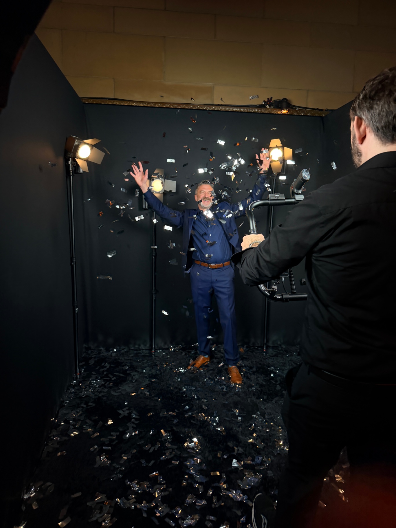 Raul Esparza tossing confetti in the Slow Motion Gimbal Video Booth