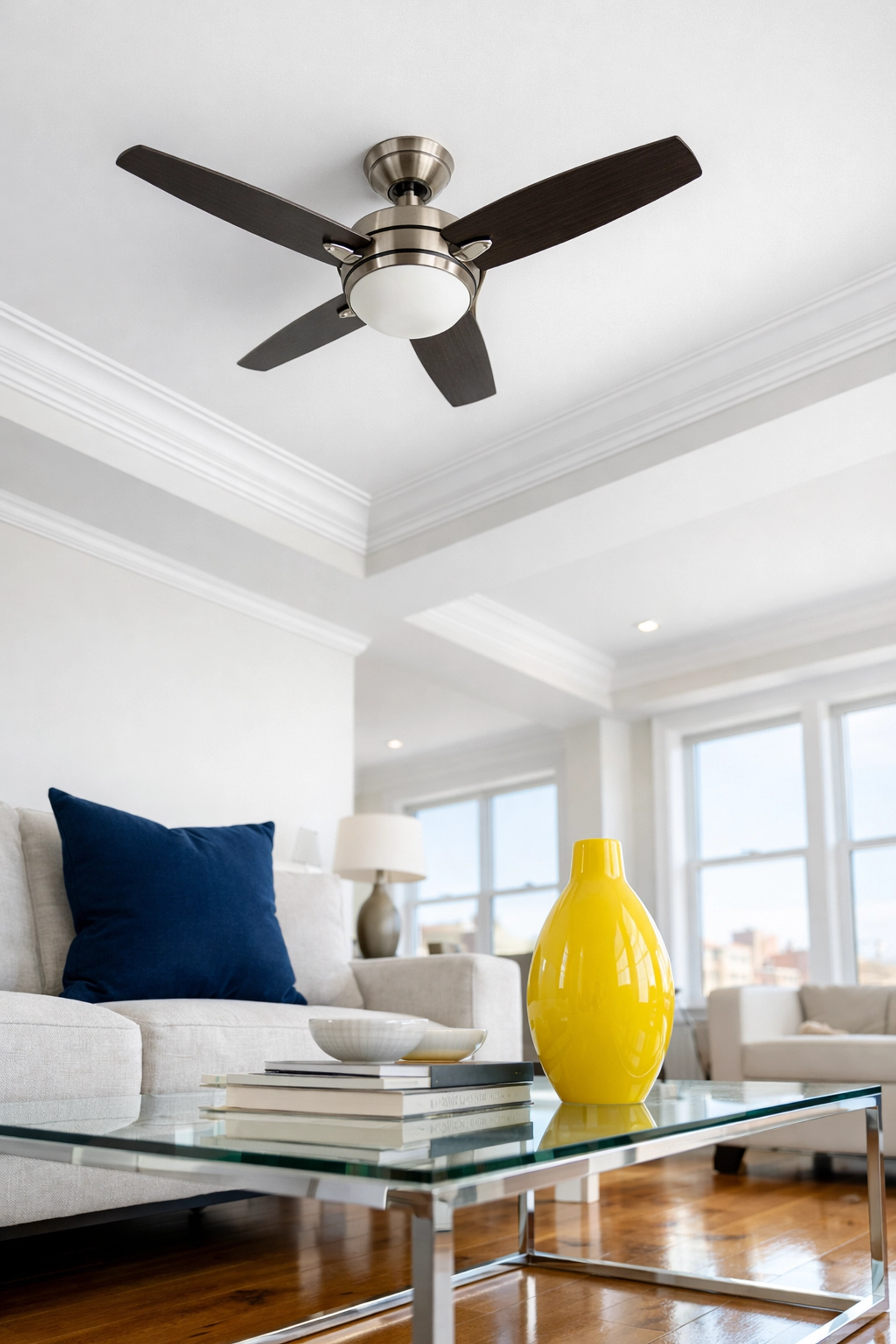 Pristine living room in Worcester showing the results of professional move-out cleaning on fans and baseboards.