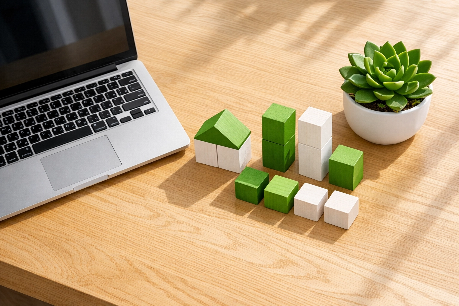 Modular blocks and a laptop illustrating custom web development for better local SEO rankings.