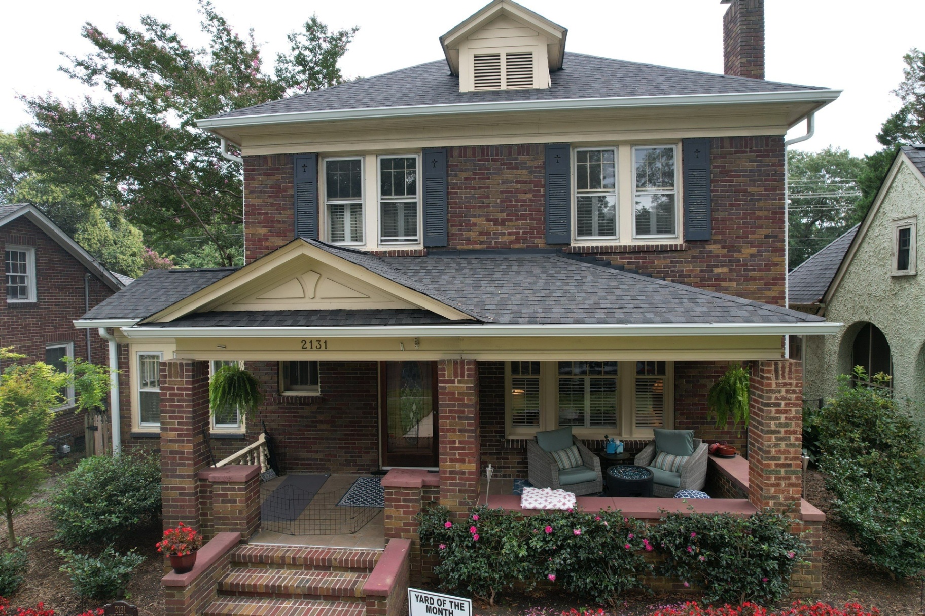 Two-story brick home with new roof and yard award