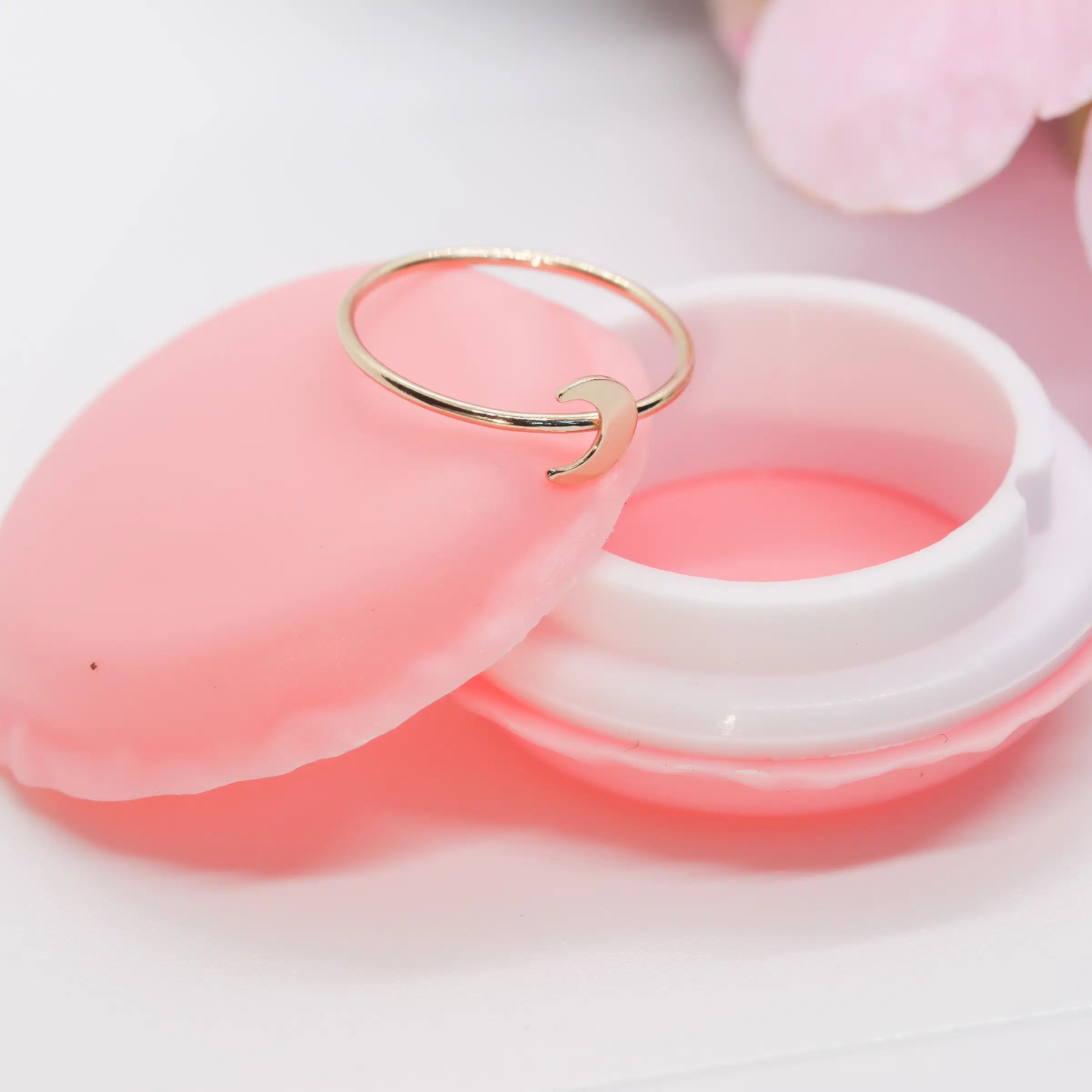 Crescent moon ring displayed on our upgraded macaroon jewelry case.