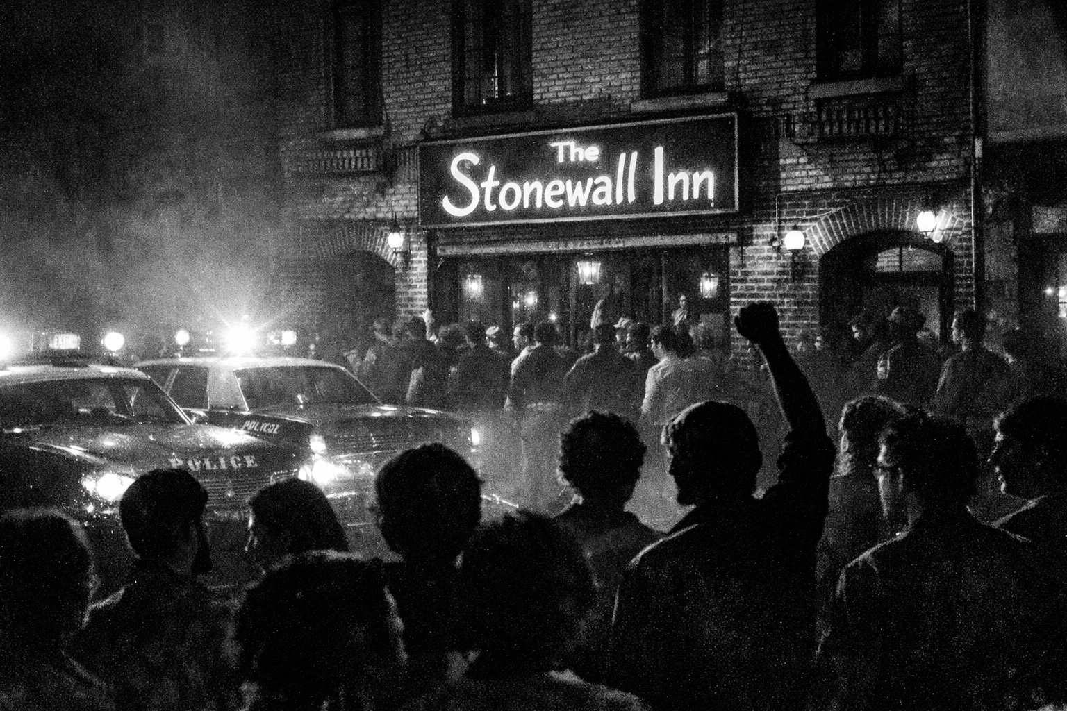 Stonewall Inn exterior during 1969 uprising with LGBTQ+ crowd gathering in defiance