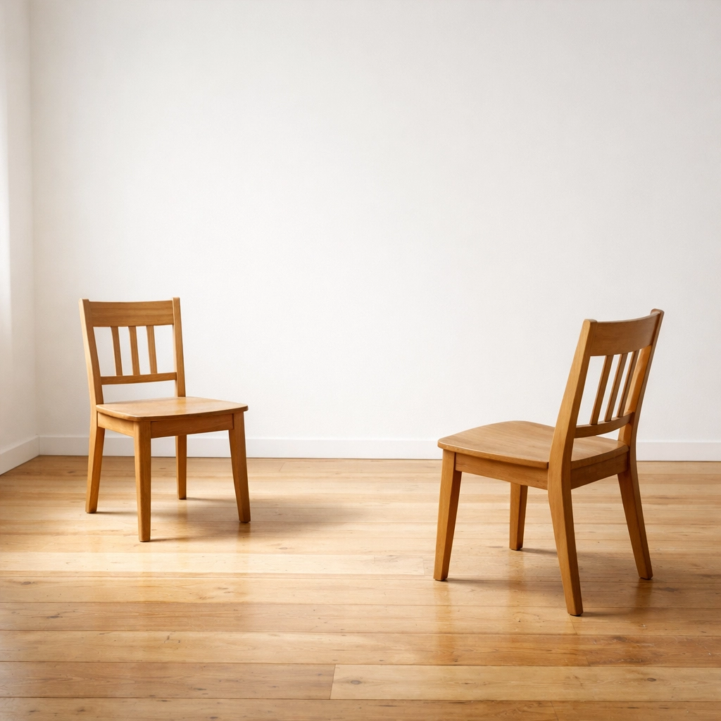 Two chairs positioned for direct conversation symbolizing executive confrontation and dialogue Two chairs positioned for direct conversation symbolizing executive confrontation and dialogue