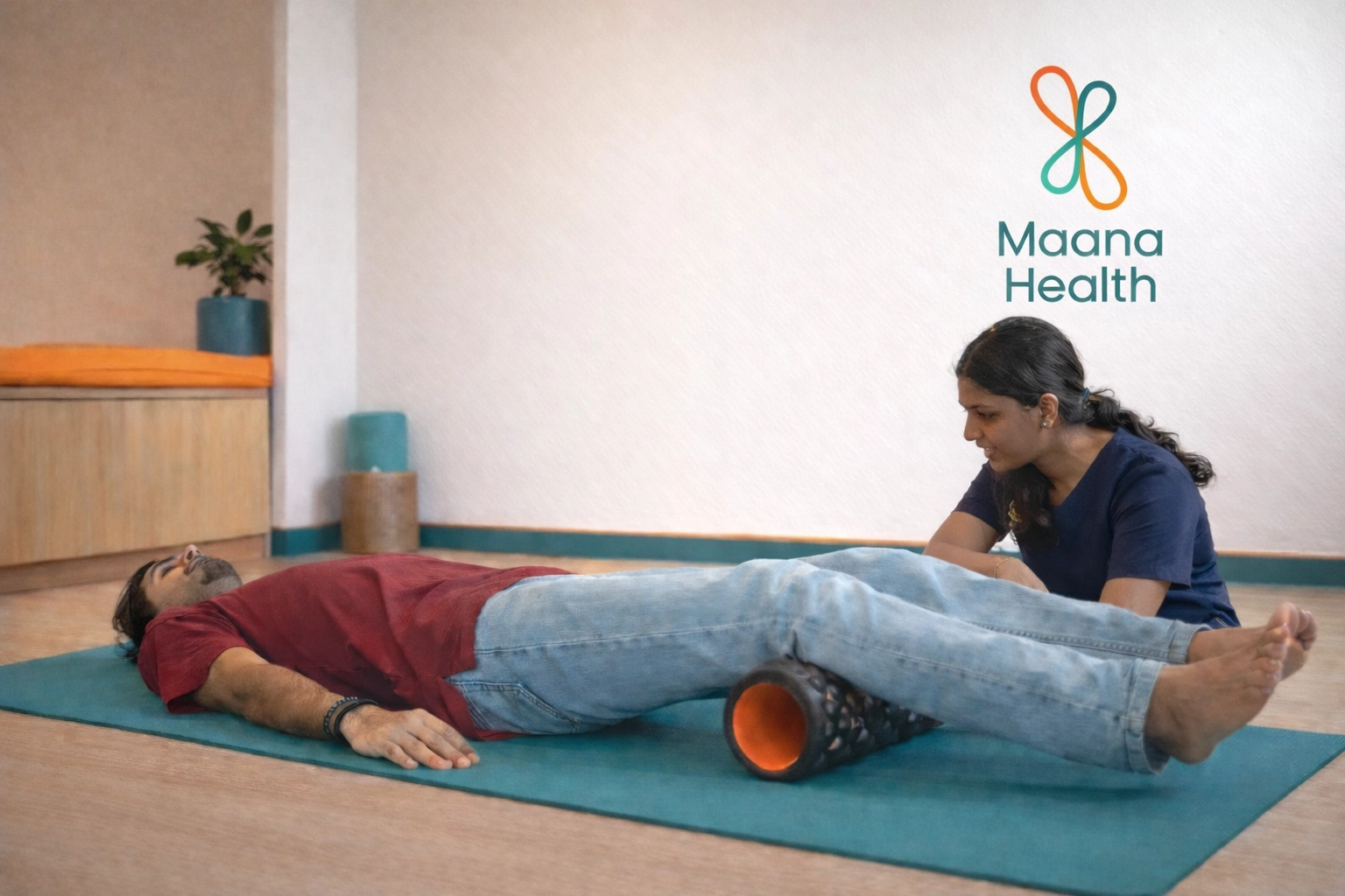 A patient using a foam roller for myofascial release in a Maana Health rehab room