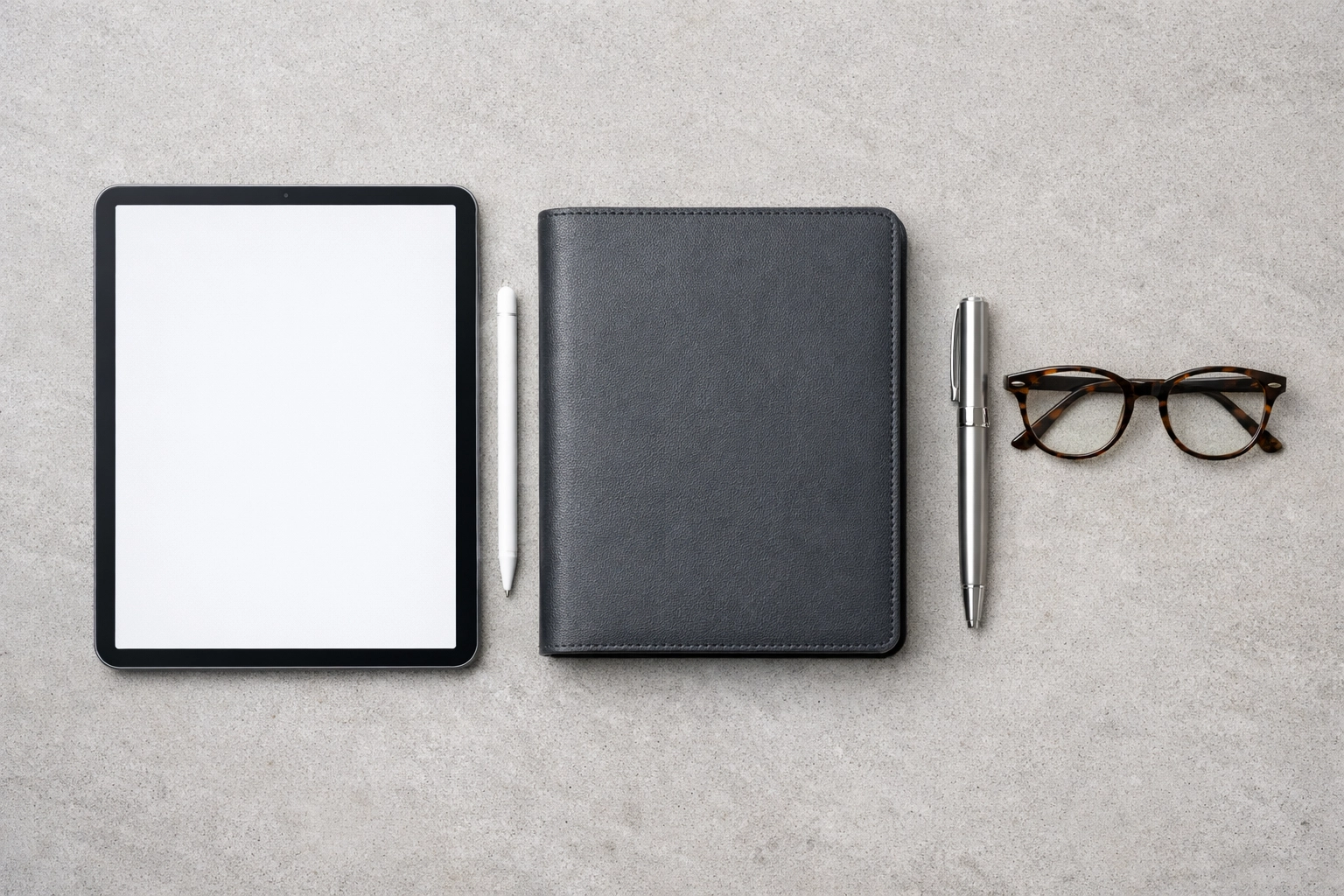 Minimalist desk layout with tablet and notebook for Service Bureau onboarding and tax business scaling.