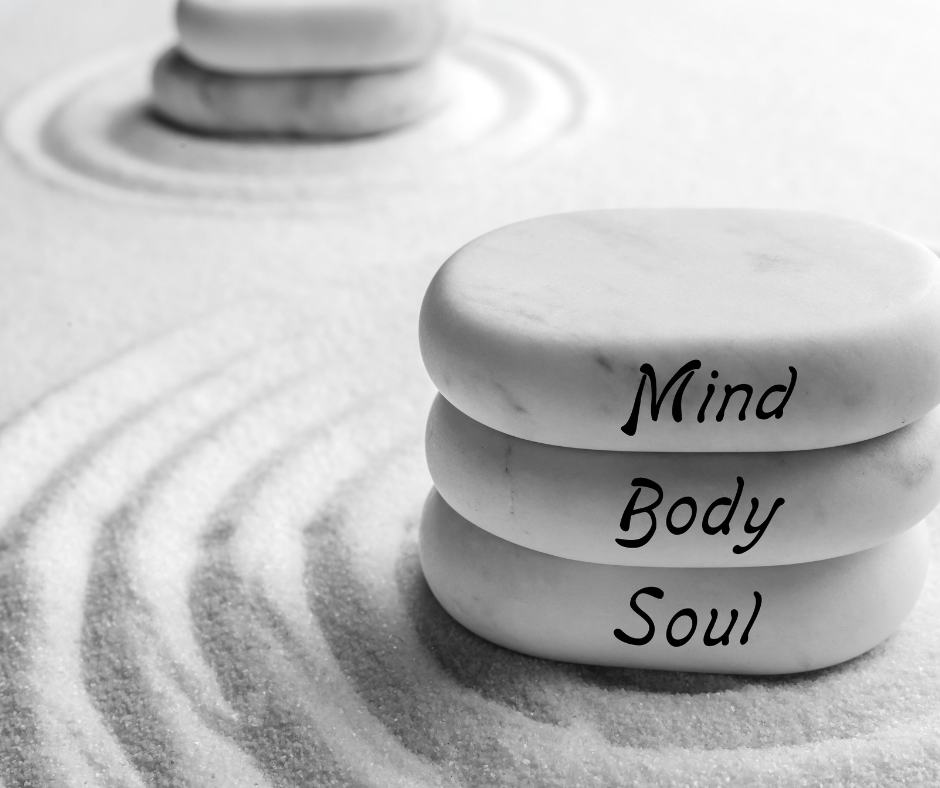 stacked-mind-body-soul-stones-on-sand.png