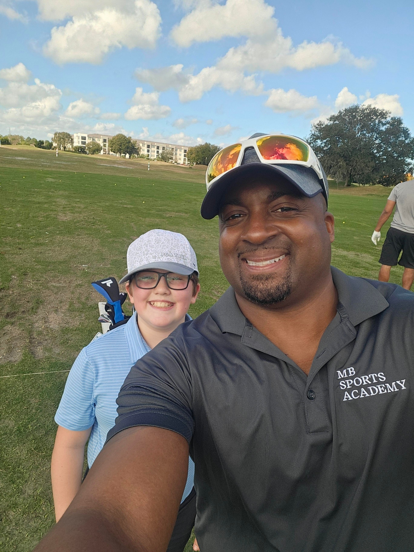 Coach with Young Athlete at MB Sports Academy Golf Range