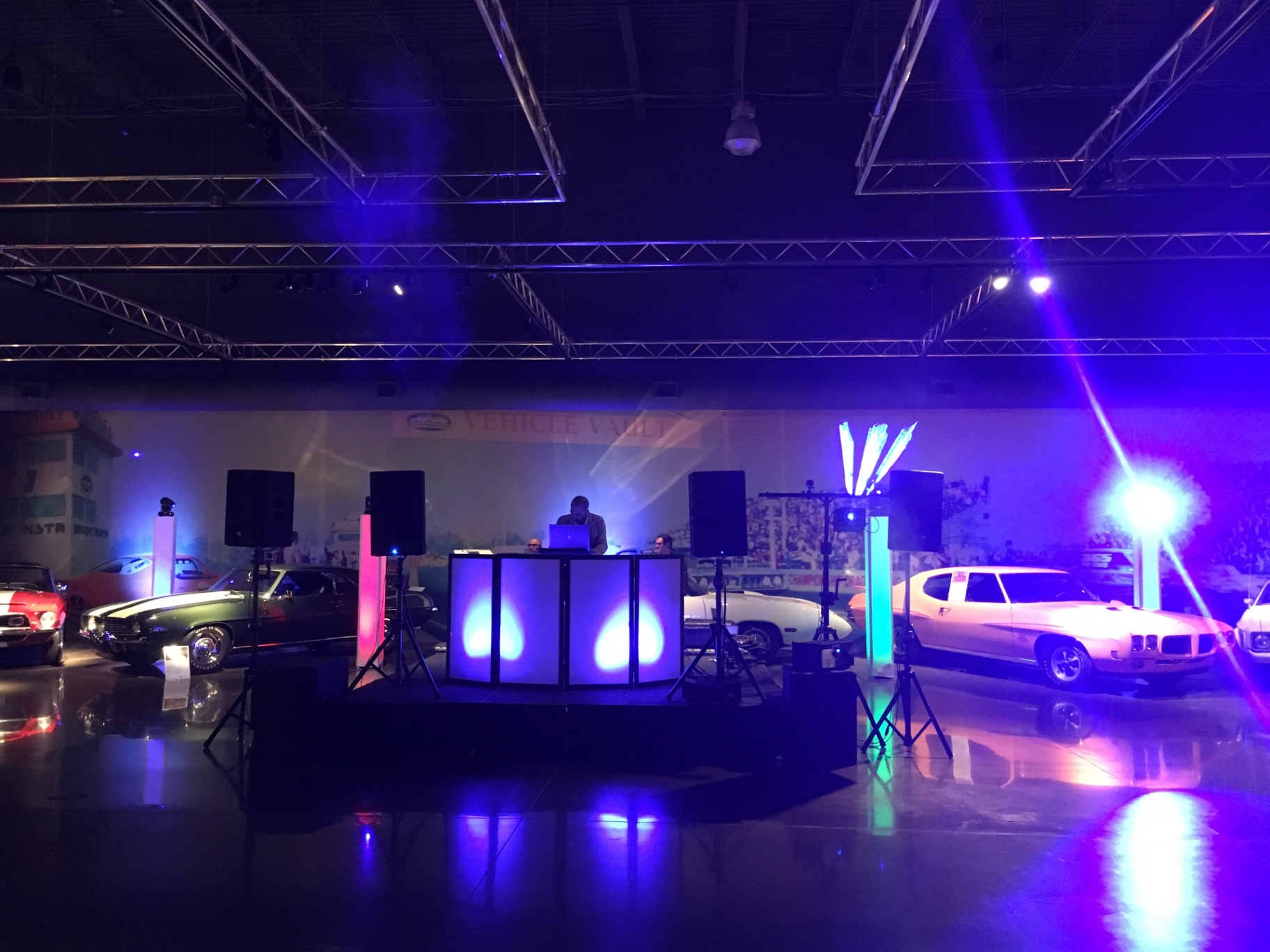 Modern DJ Booth with Classic Cars