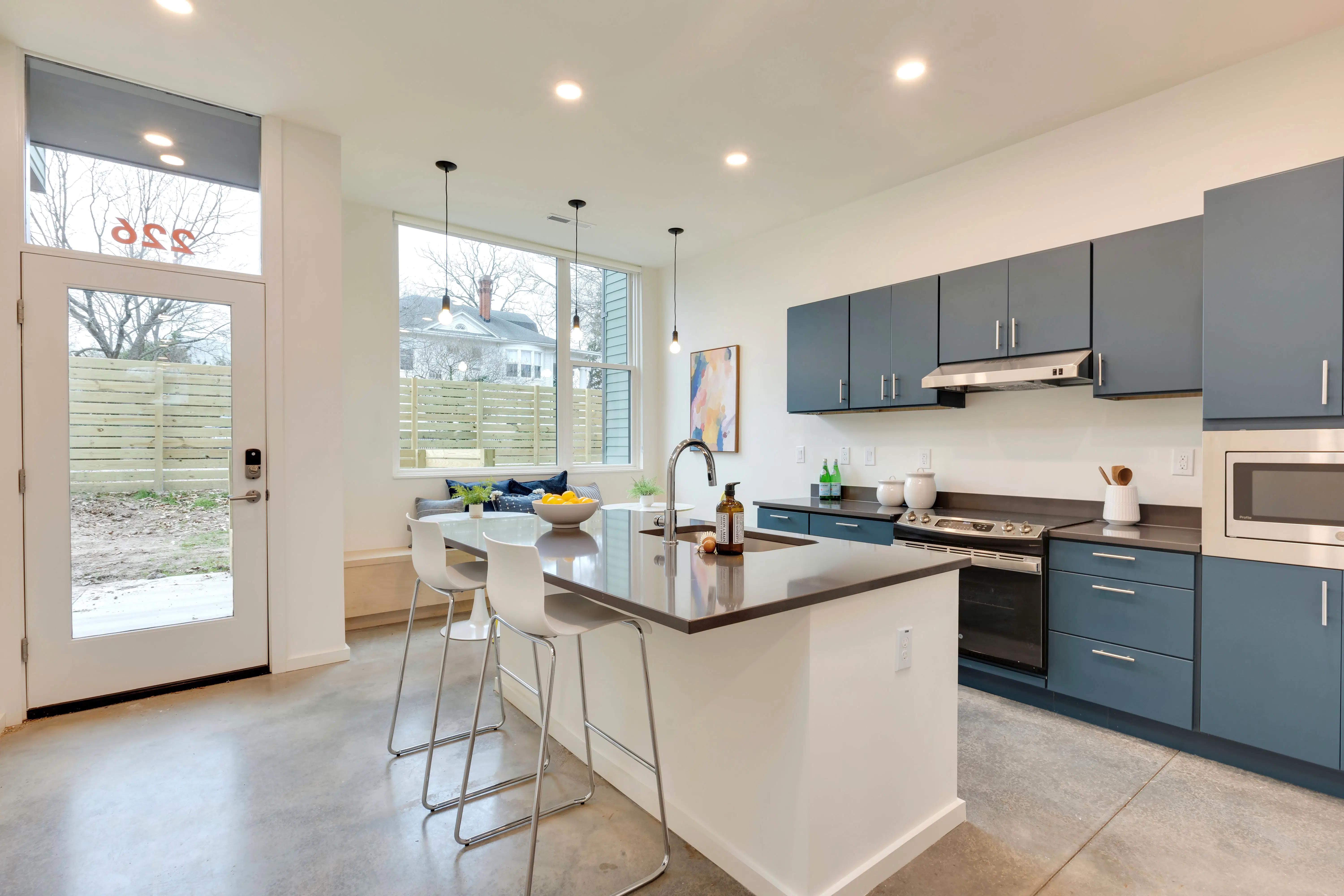 Modern shared kitchen with island and bar seating