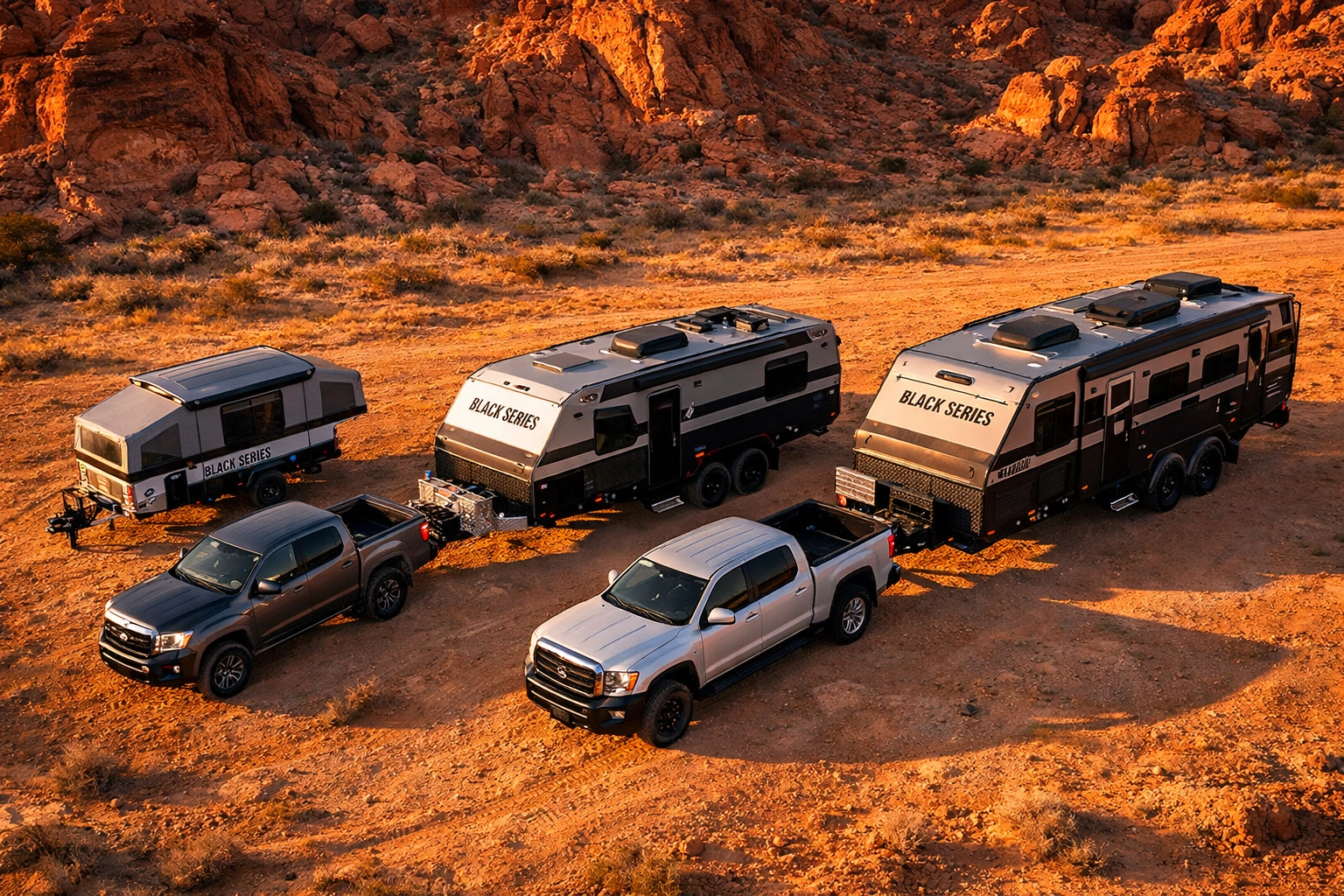 Three Black Series off-road trailers in different sizes parked in desert terrain