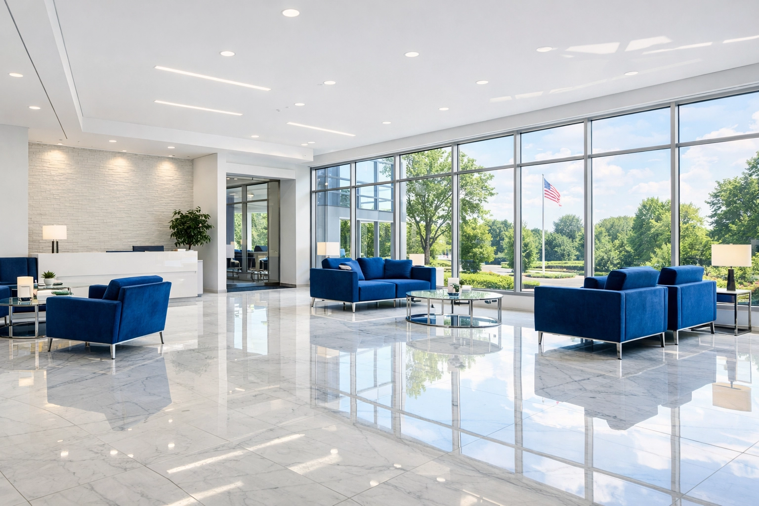 Sparkling clean corporate lobby in Bedford with white marble floors, showcasing professional office cleaning results.