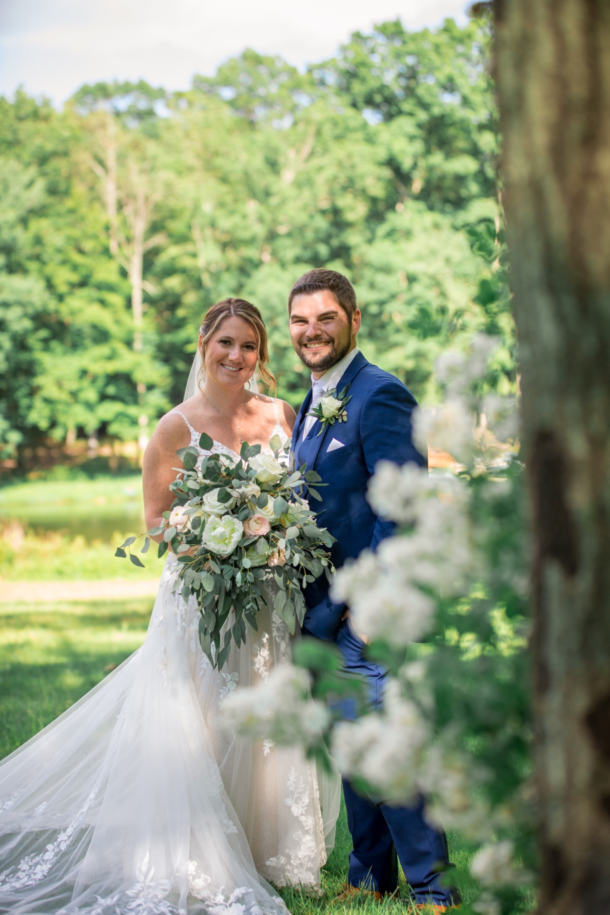 Tightly framed portrait of Samantha and Tyler smiling together on their wedding day
