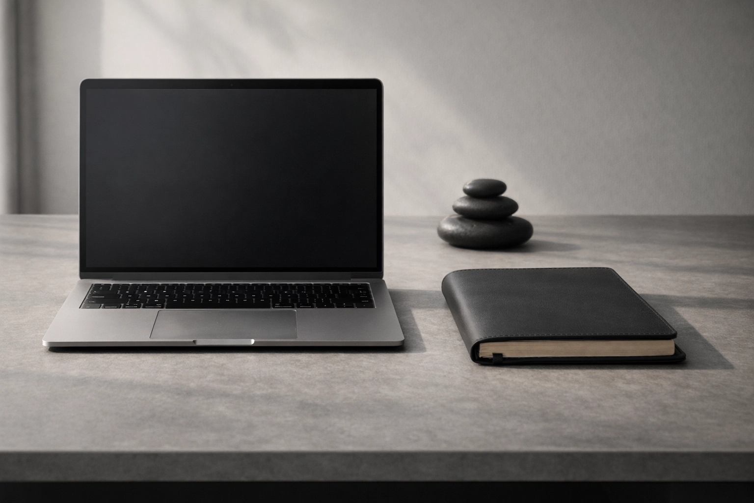 Minimalist desk with balanced stones symbolizing fiscal discipline and fractional growth partner ROI.