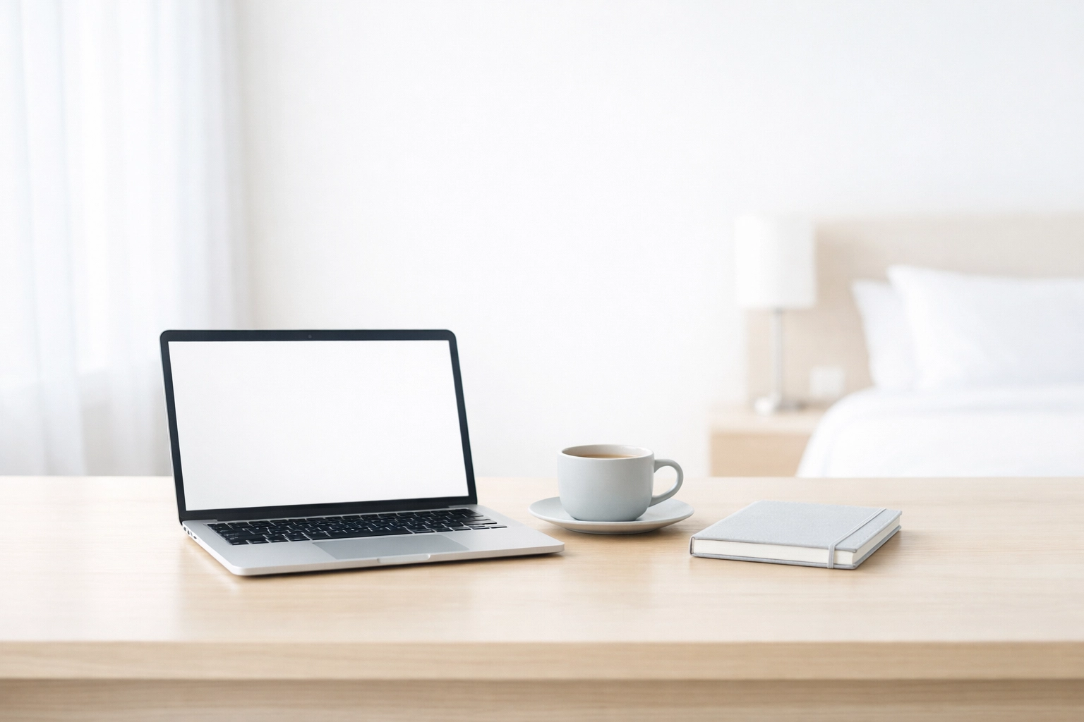 Clean hotel office workspace with a laptop representing seamless property management technology.