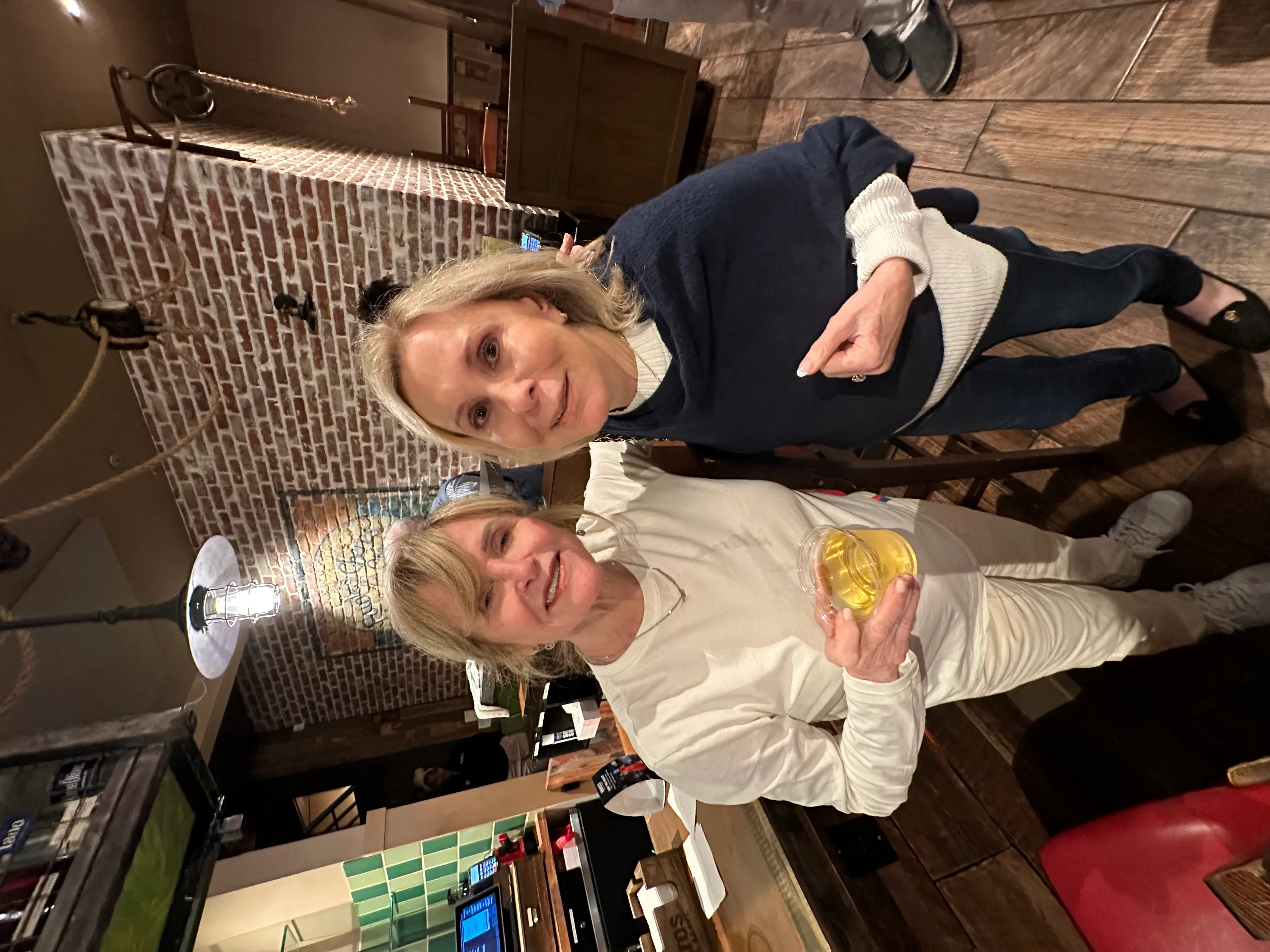 Two professionals partnering in a warm office setting, emphasizing a consultative relationship