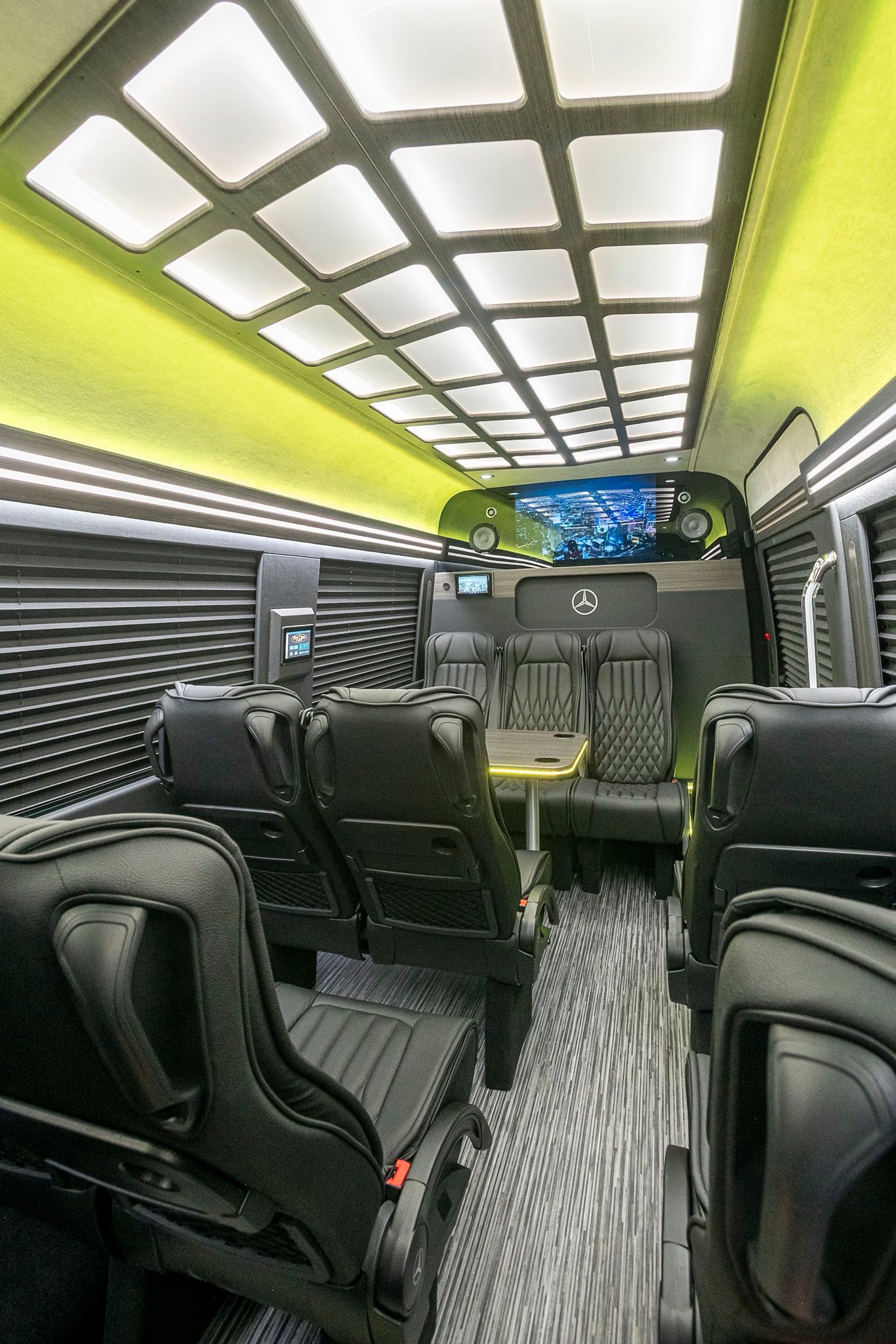 Modern Mercedes-Benz executive Sprinter interior featuring luxury captain’s chairs
