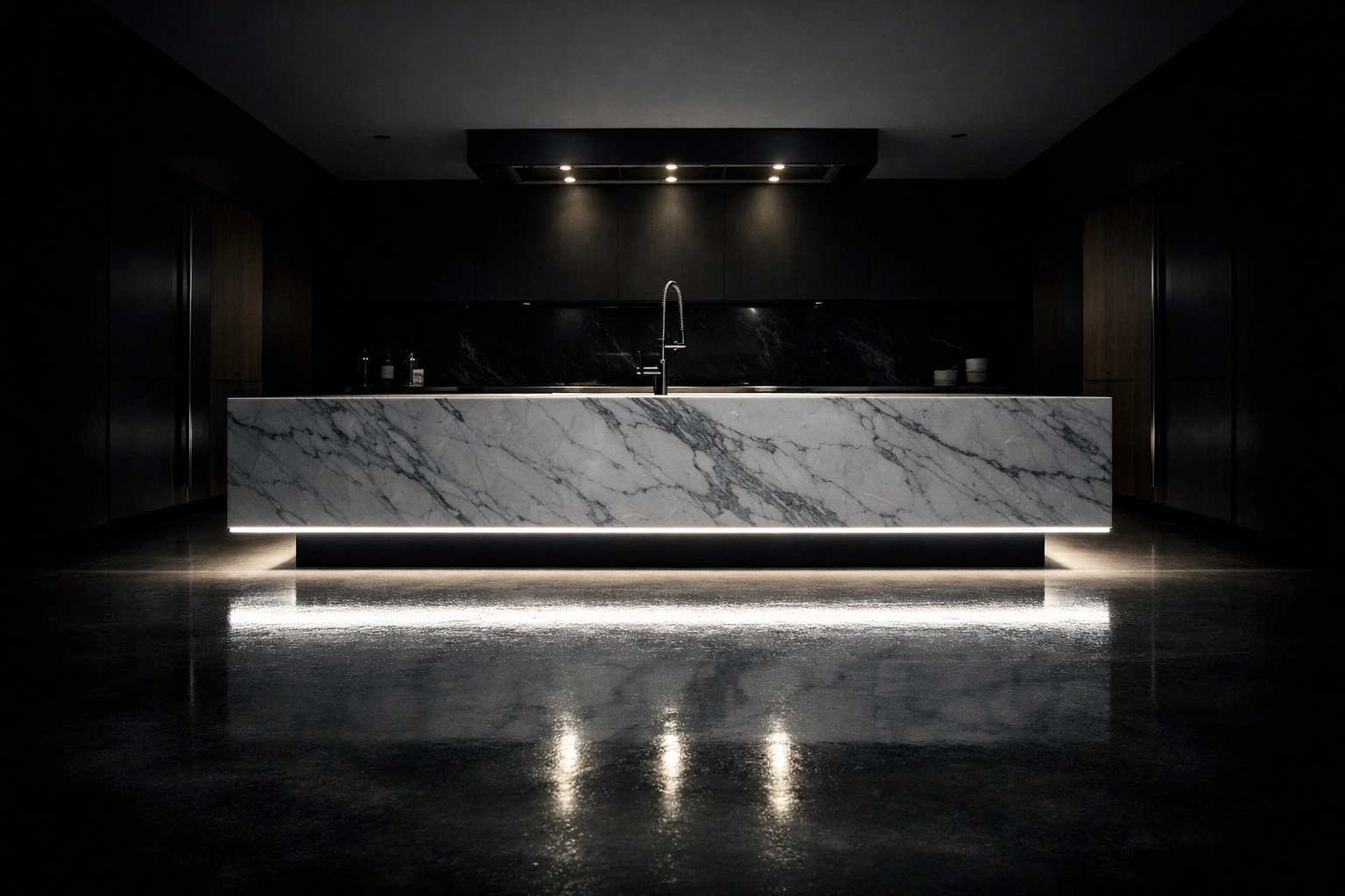 Luxury marble kitchen island with integrated LED toe-kick lighting creating a floating architectural effect.