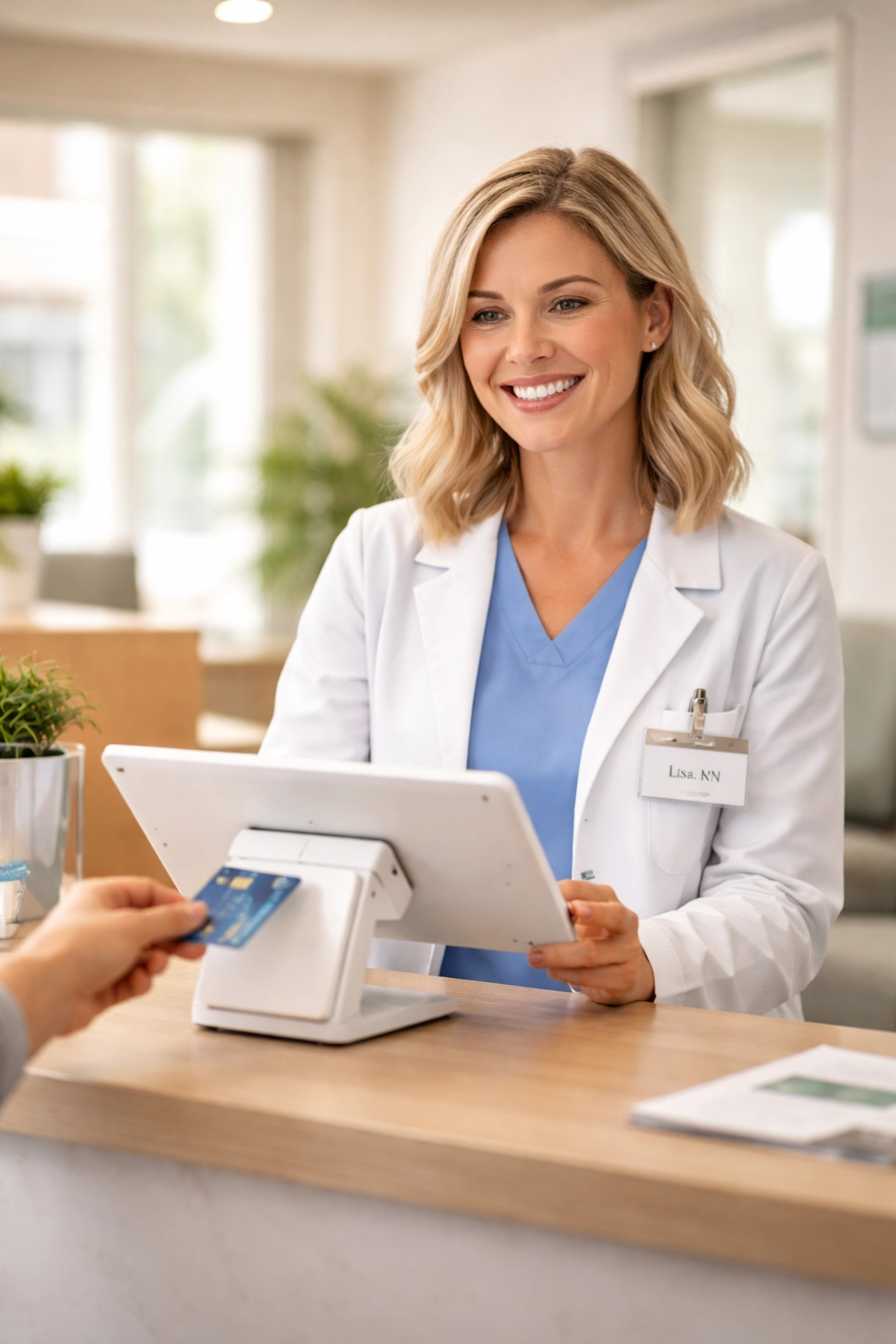 Medical office staff collecting patient payment at checkout to improve billing efficiency in healthcare.