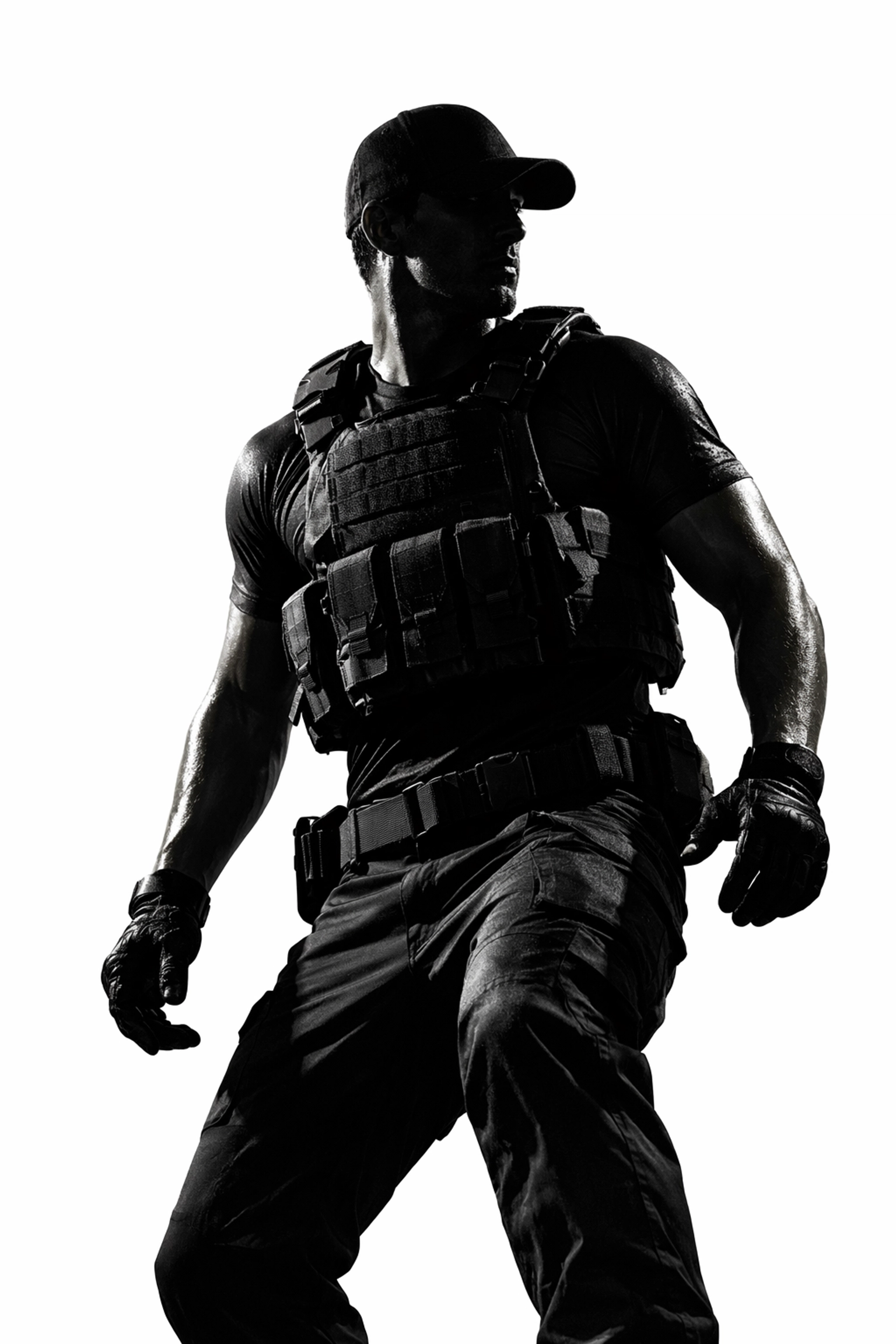 Athlete in military fitness apparel and plate carrier showing a disciplined mindset and tactical situational awareness.