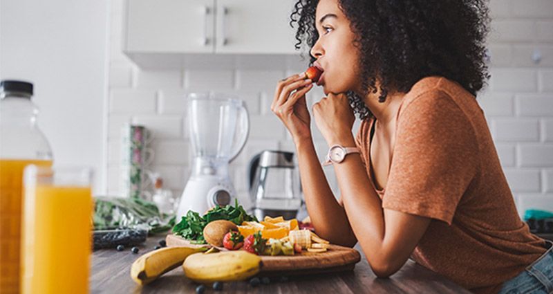 Woman enjoying her fruit medley