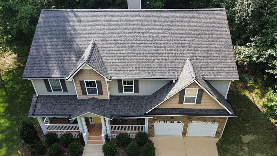 Aerial view of a newly installed architectural shingle roof