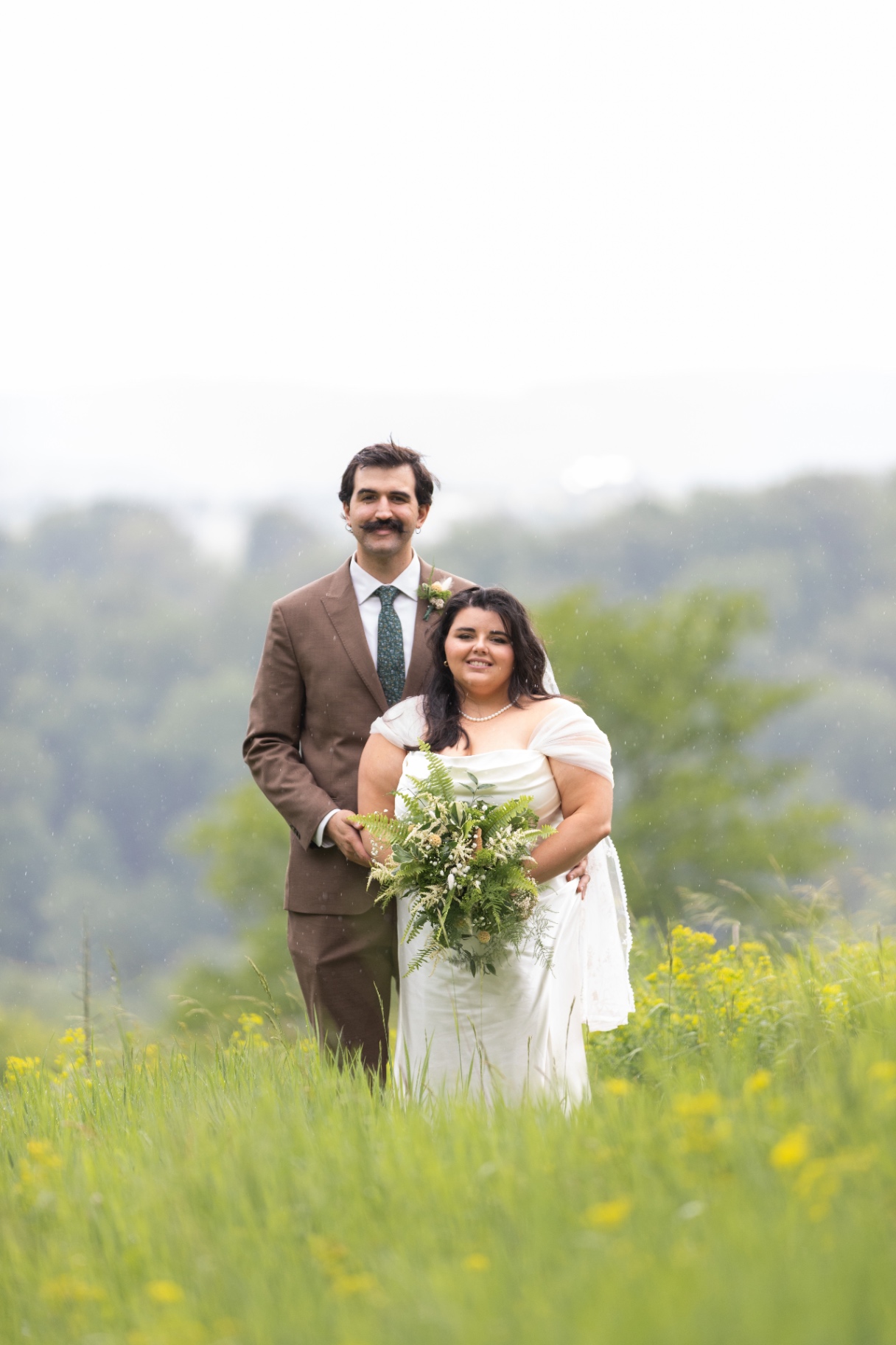 Bride and Groom in Rainy Meadow