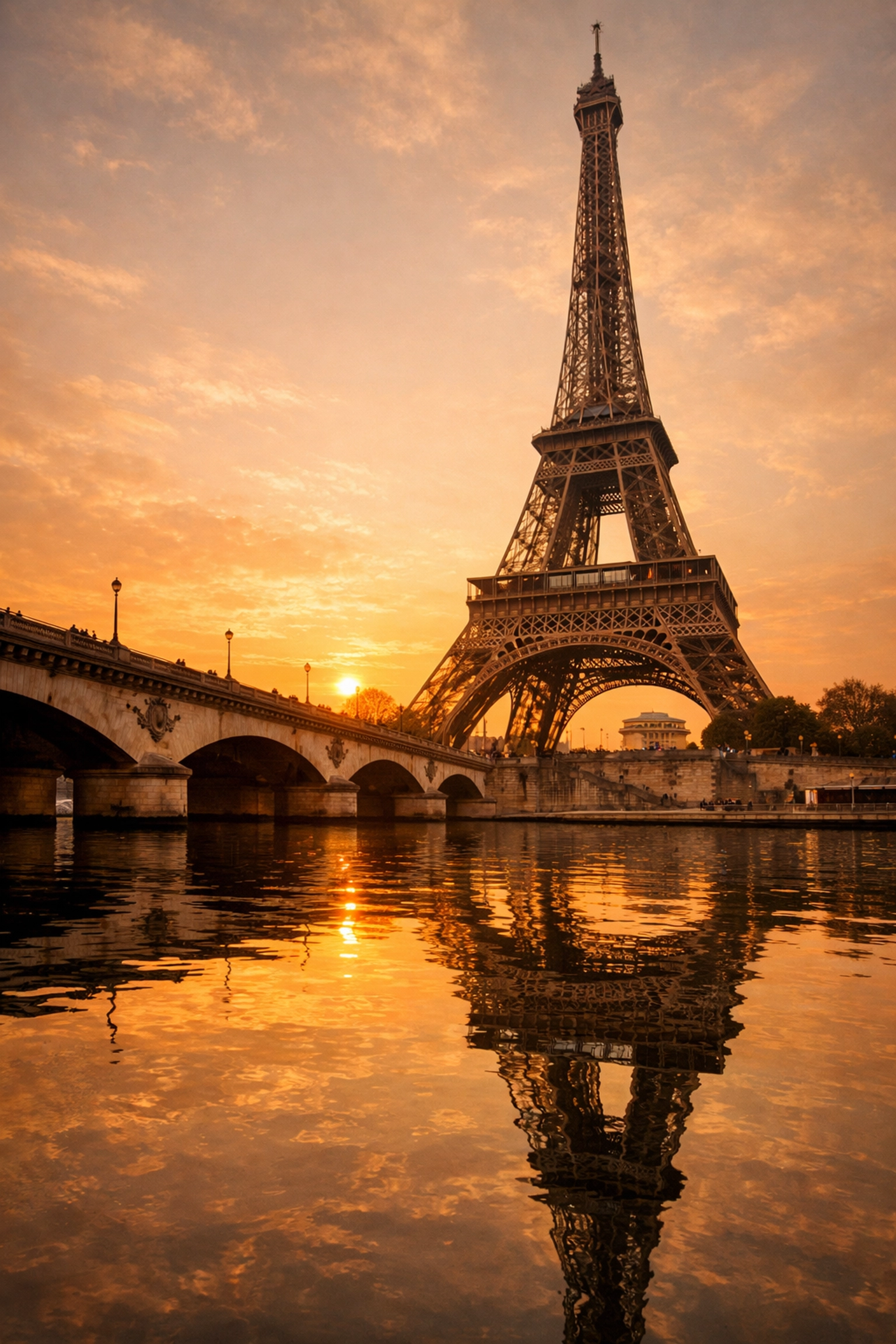 Golden hour view of the Eiffel Tower from the Seine, illustrating travel photography tips for Paris.