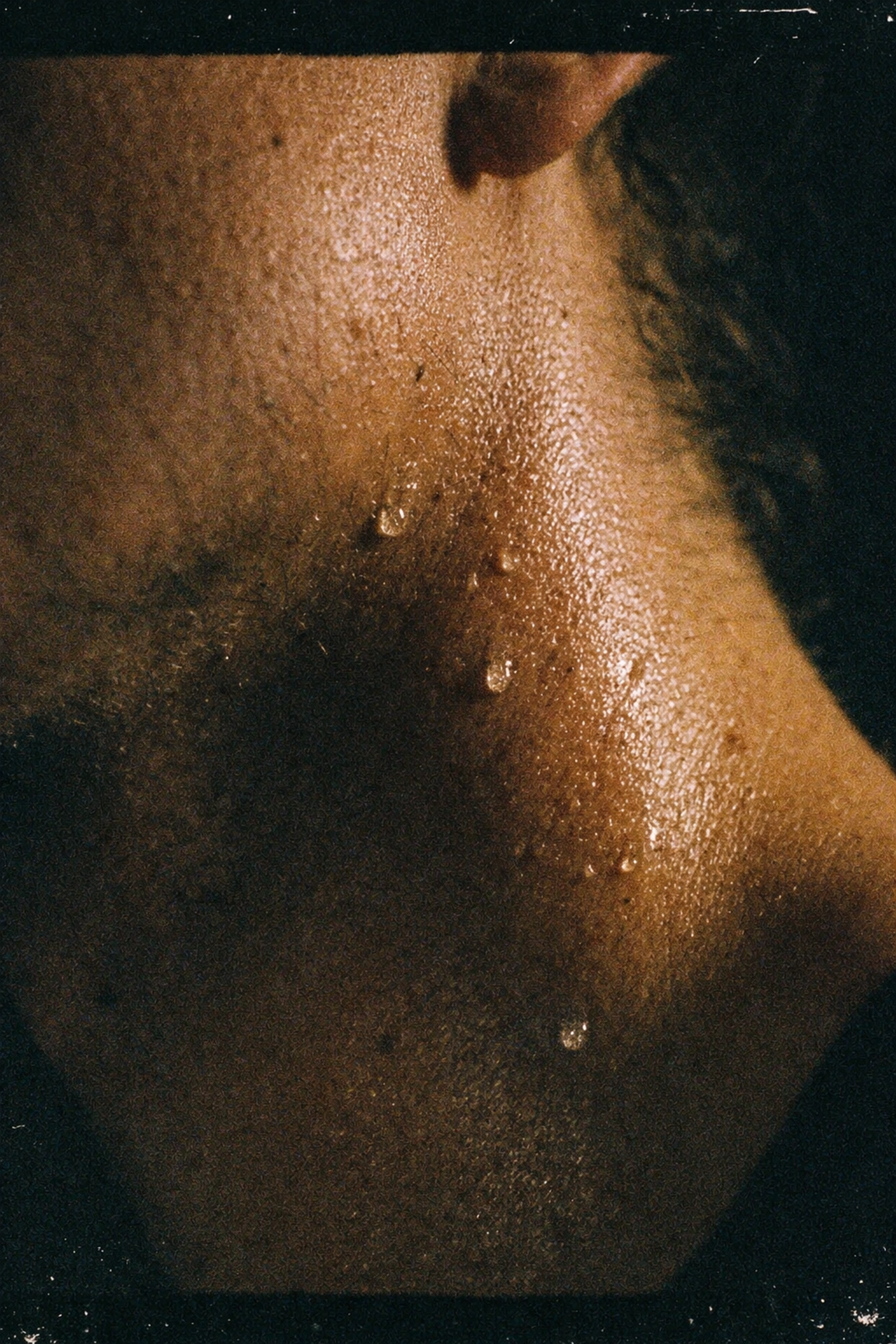 Close-up of sweat on a neck showing chemosignals of arousal and sexual interest.
